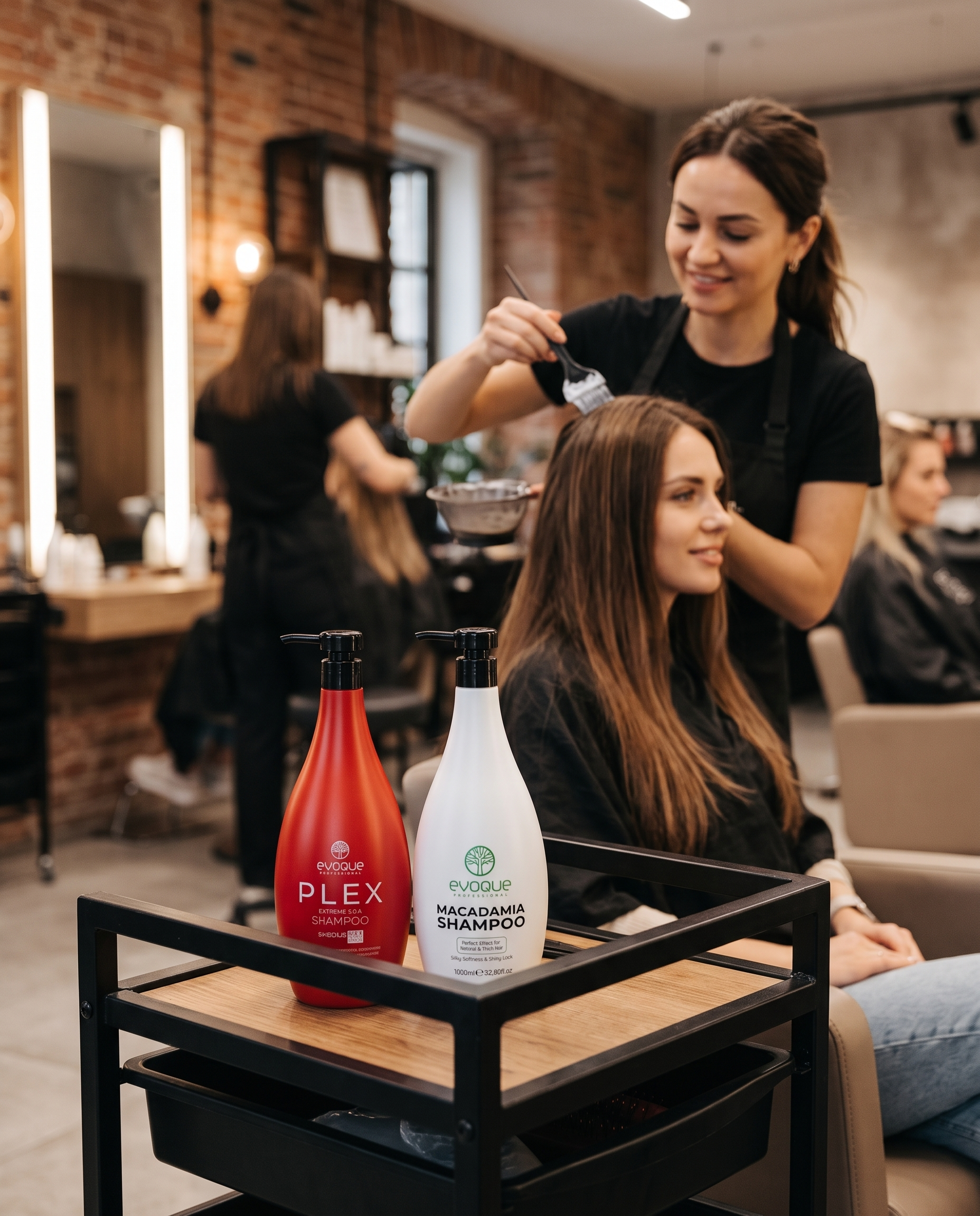 Stylist applying Evoque treatment in a professional salon