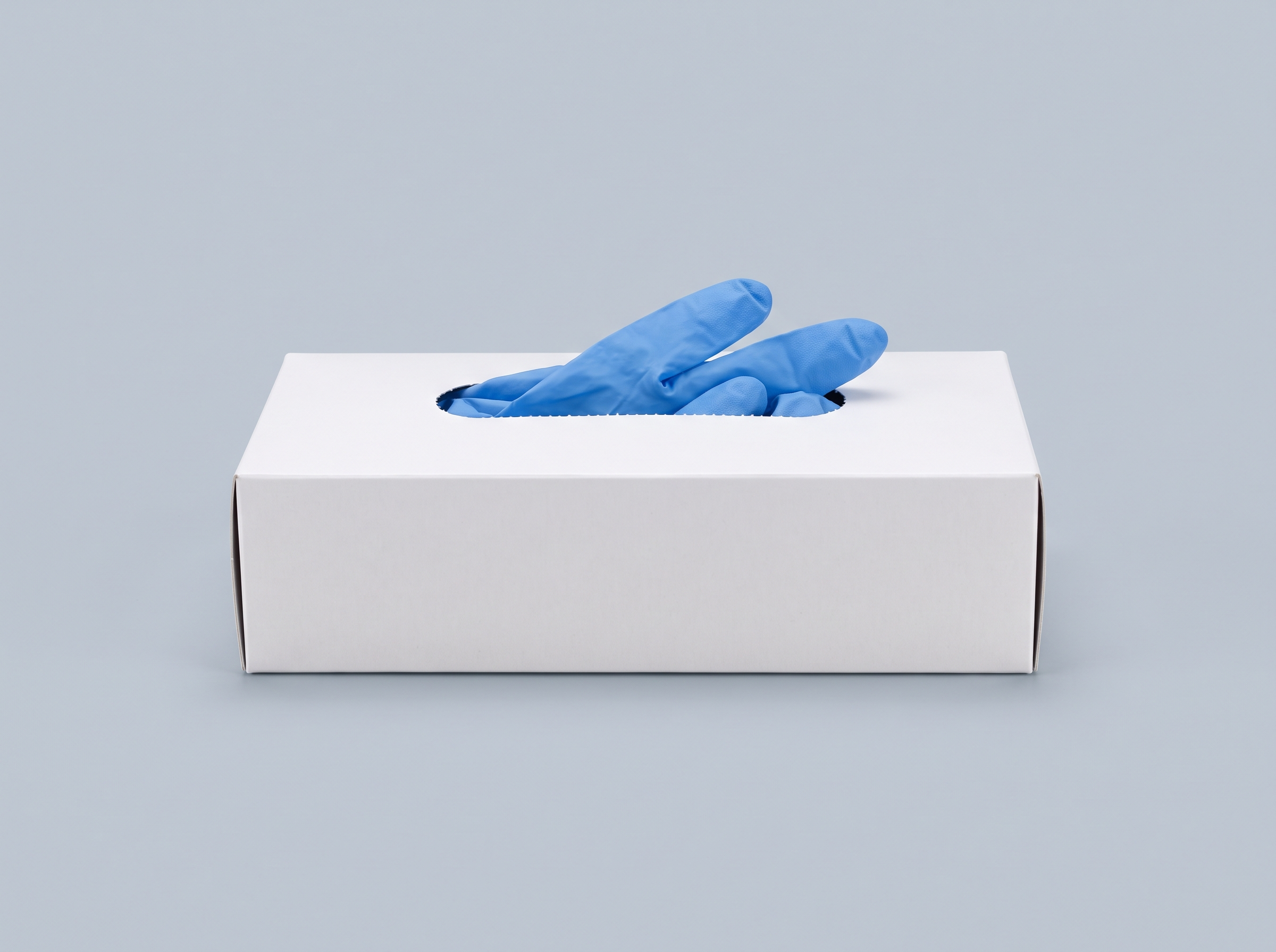 A box of nitrile gloves with two gloves emerging