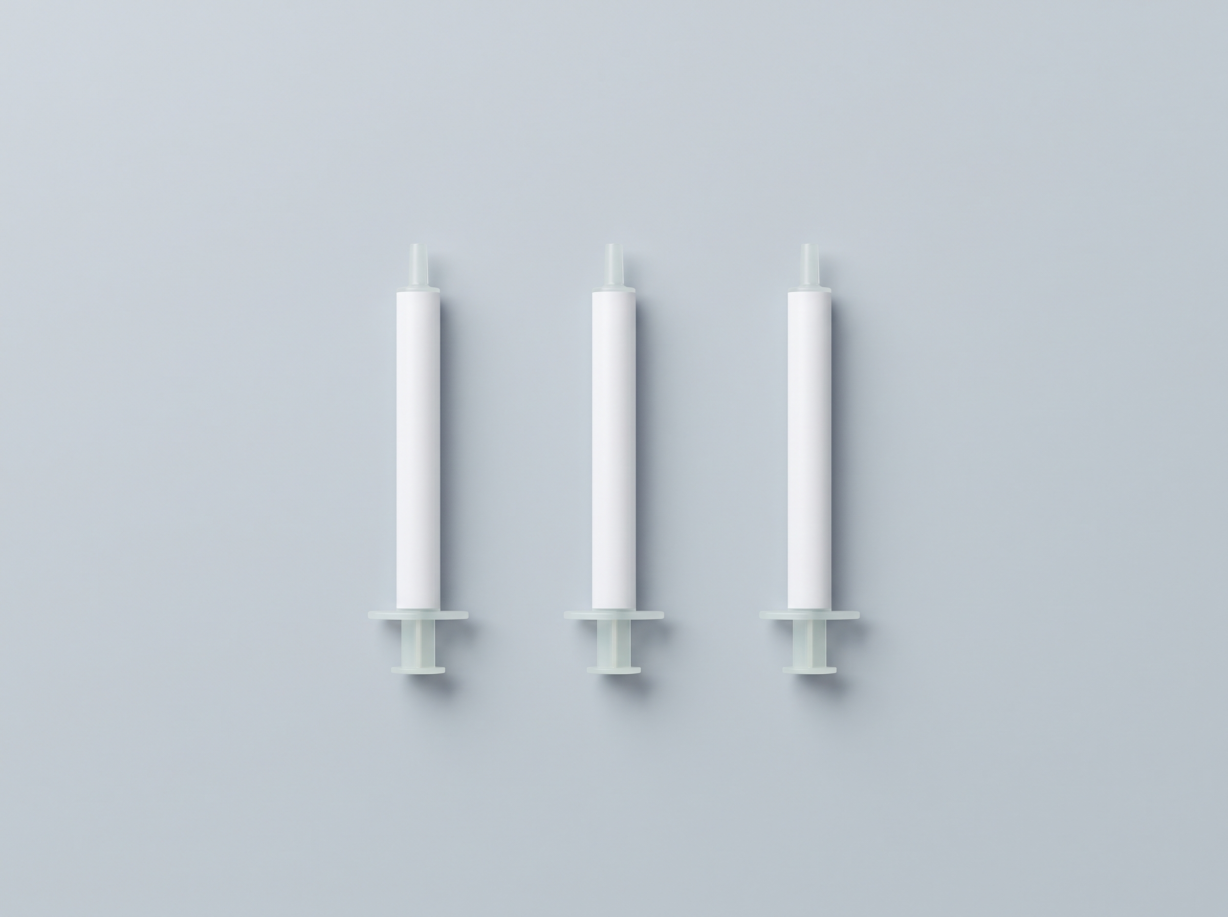 Three insulin syringes laid out beside their box