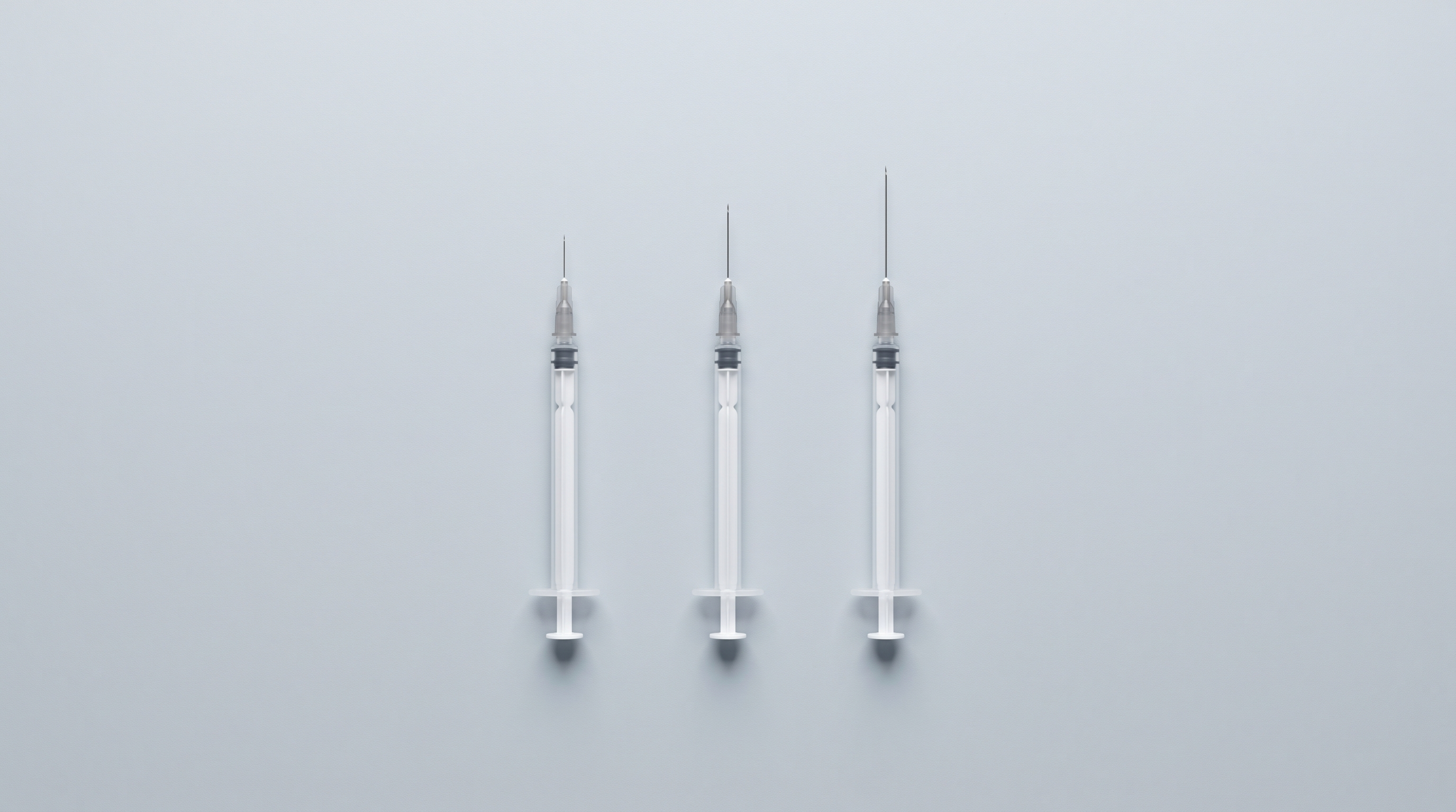 Three syringes of different needle lengths side by side