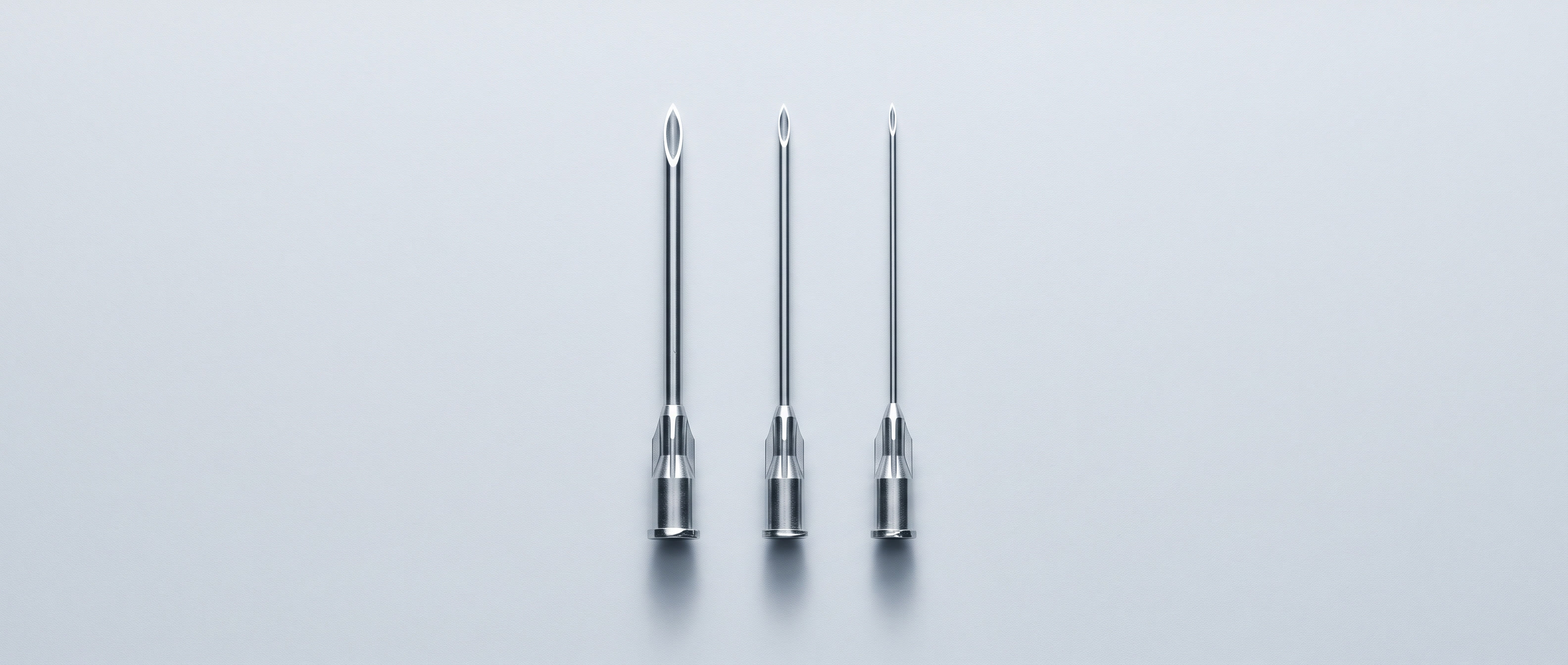 Three needles of different thicknesses in a row