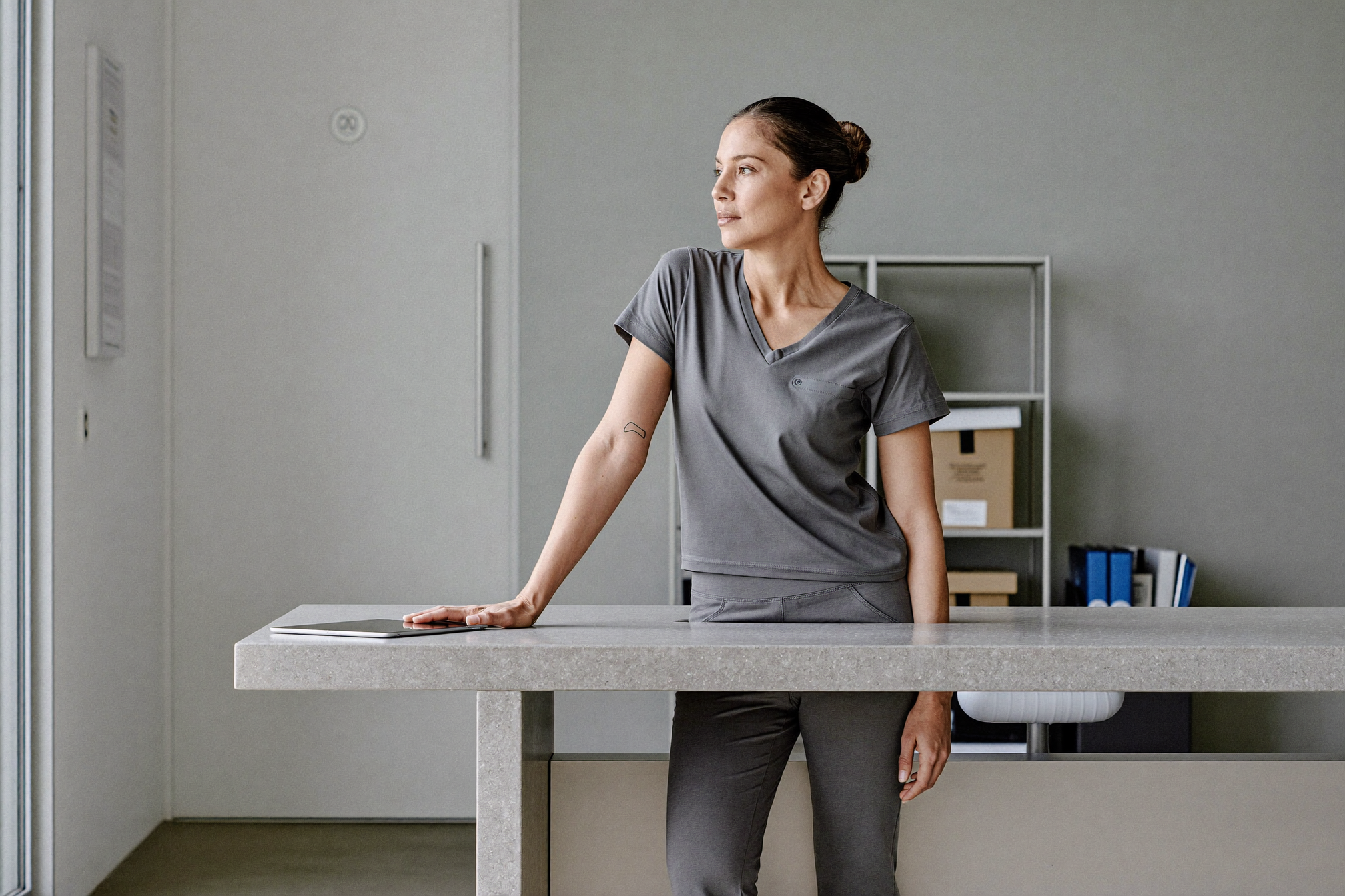 A practice manager at a clinic back-office bench