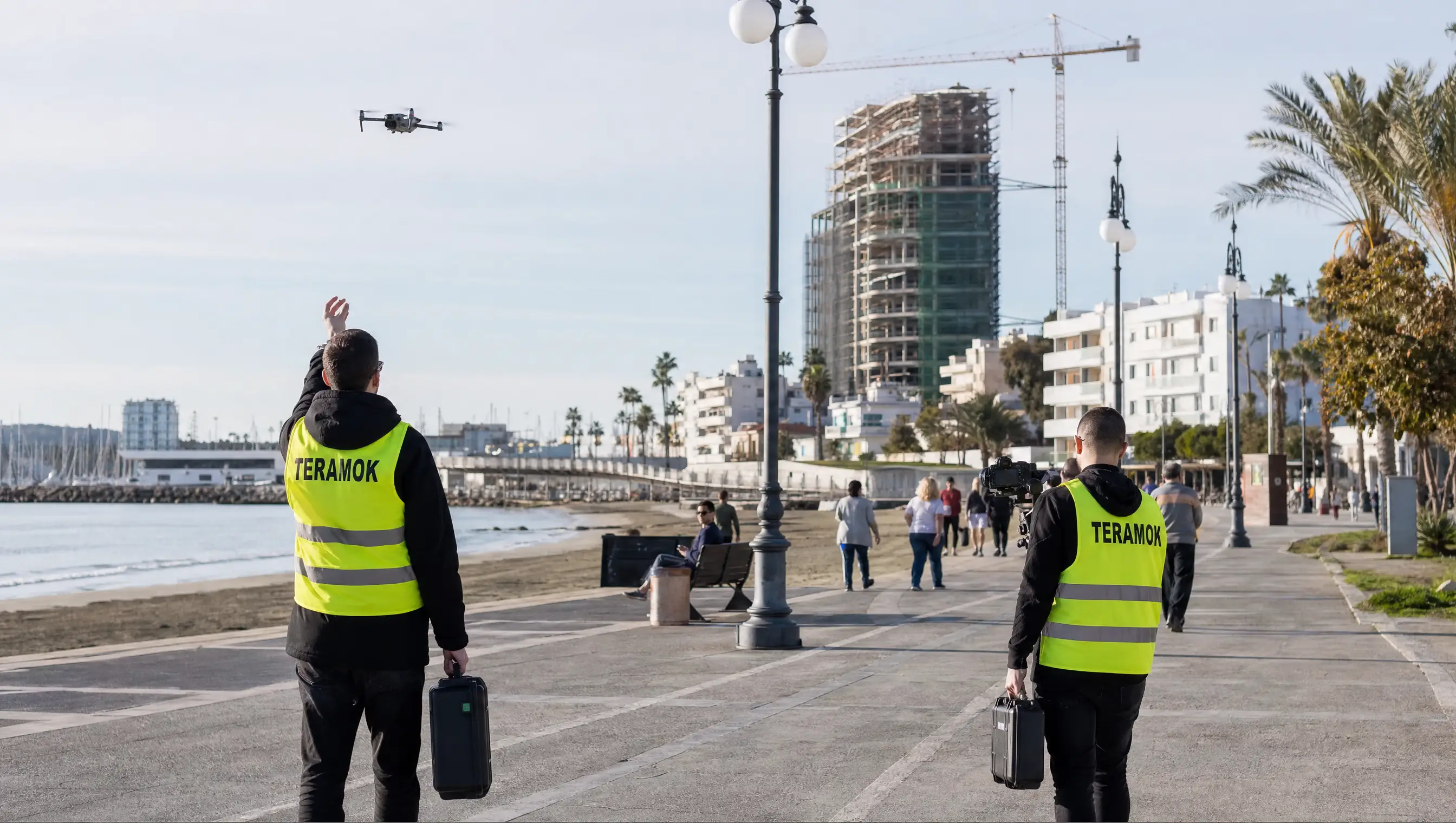 Larnaca seafront with a new residential tower under construction near the marina, filmed by a TERAMOK drone crew, real estate marketing in Larnaca