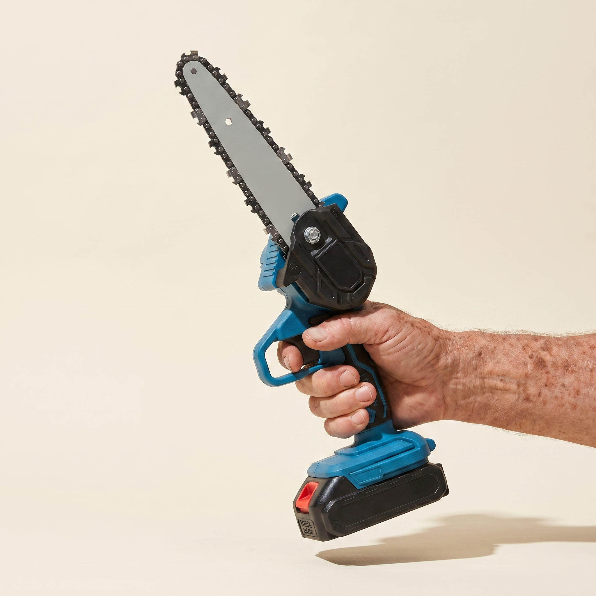 Mini chainsaw held easily in one hand