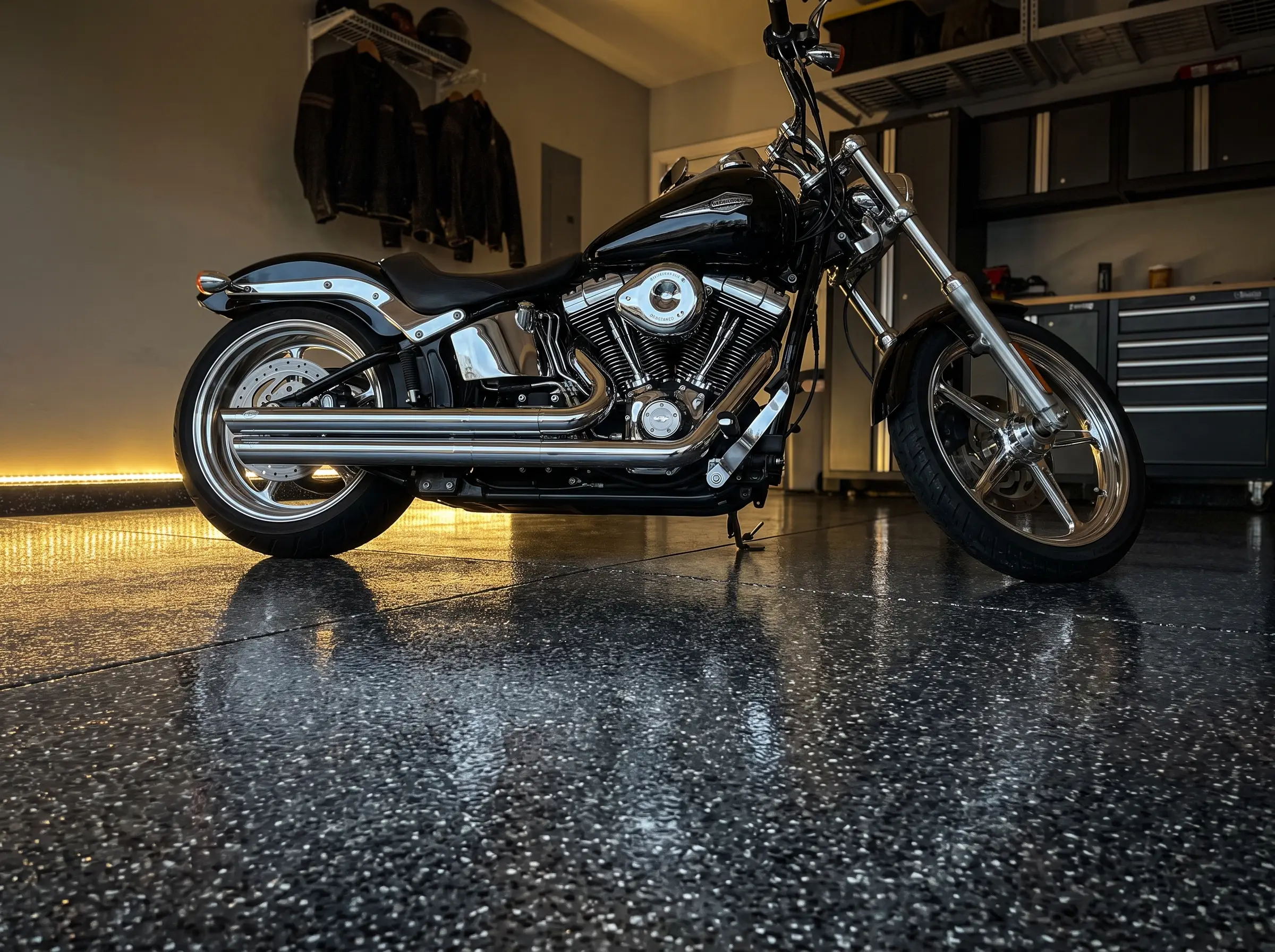 Motorcycle reflected in a charcoal flake floor