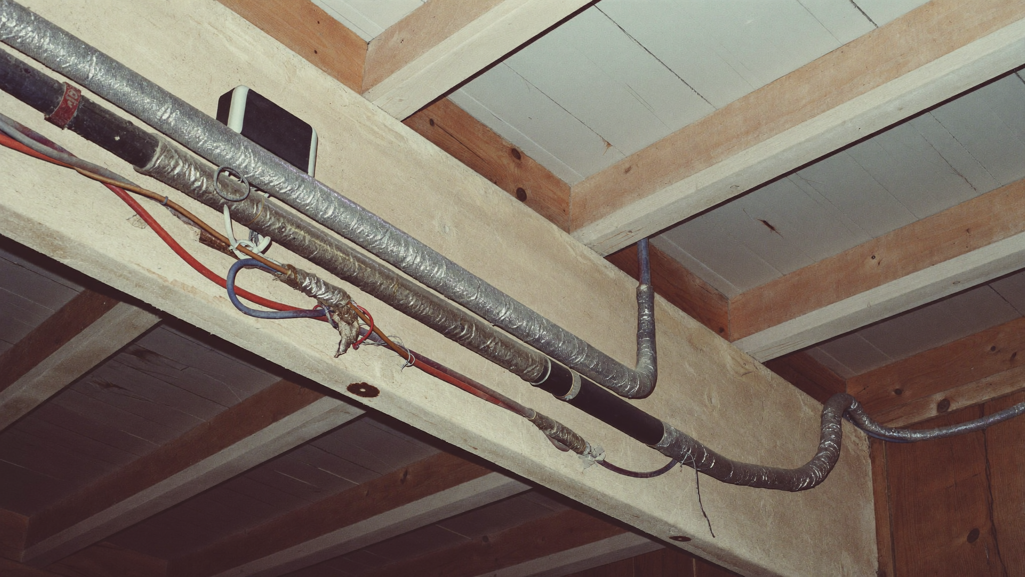 Old fabric-insulated wiring in the roof cavity of an older Adelaide home