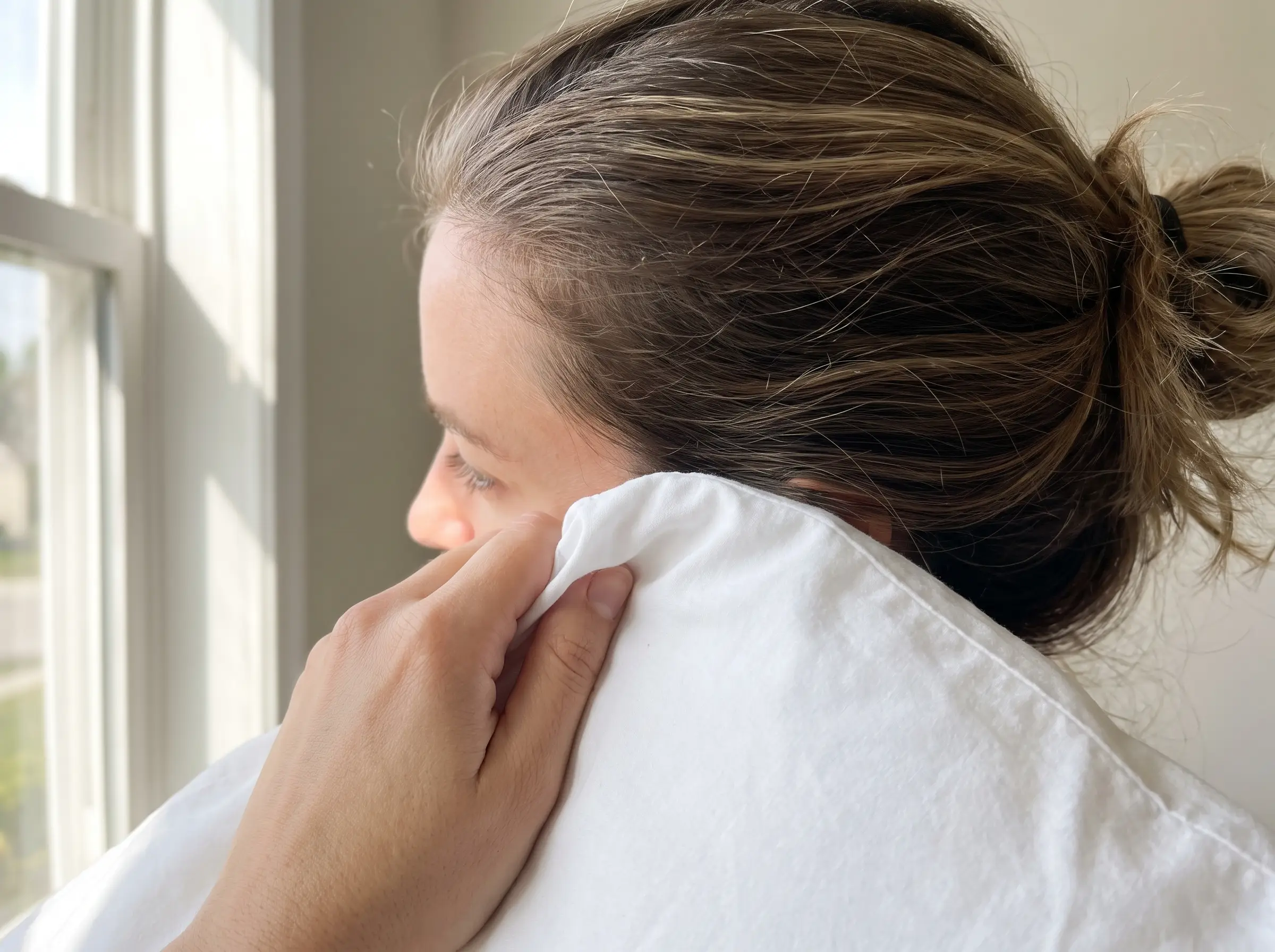 White cotton pillowcase pressed against hair with Hair Rich applied, showing no visible transfer