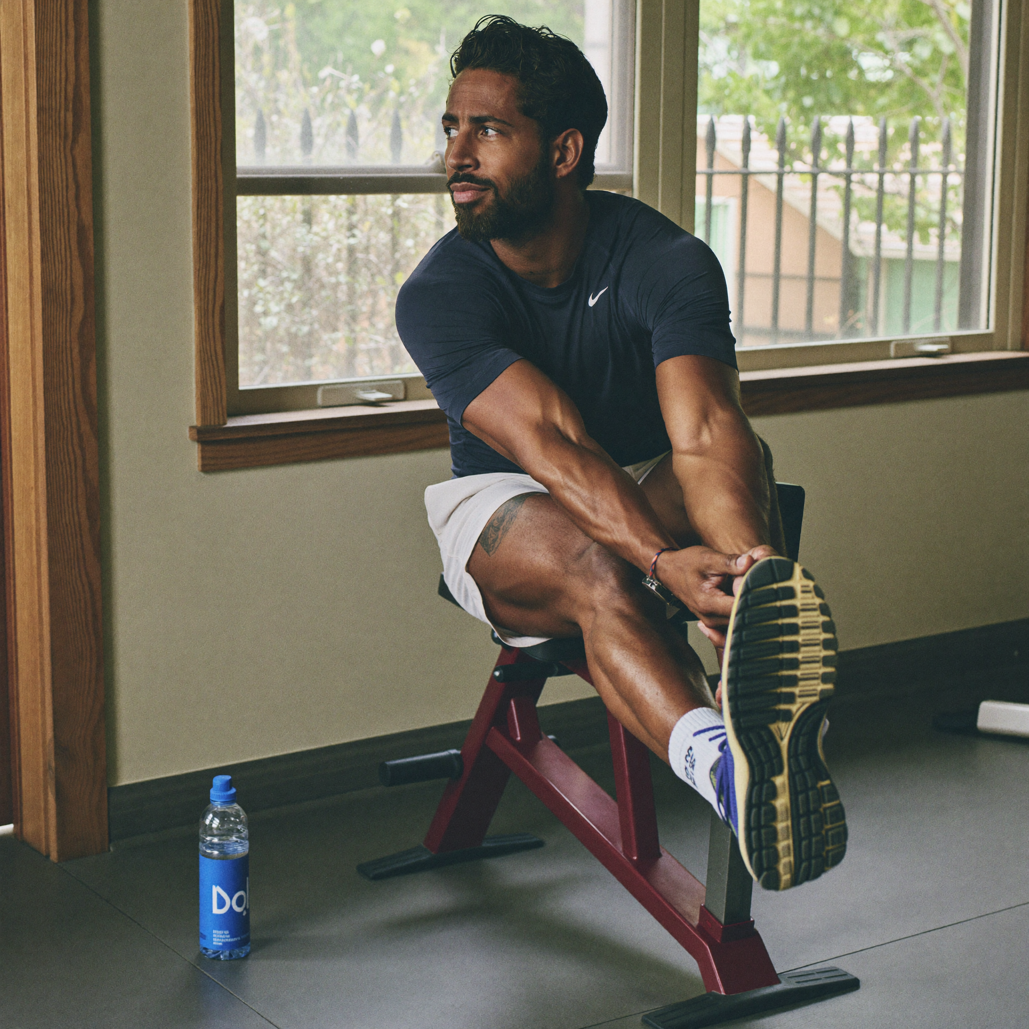 Man stretching after a workout, relaxed and recovered