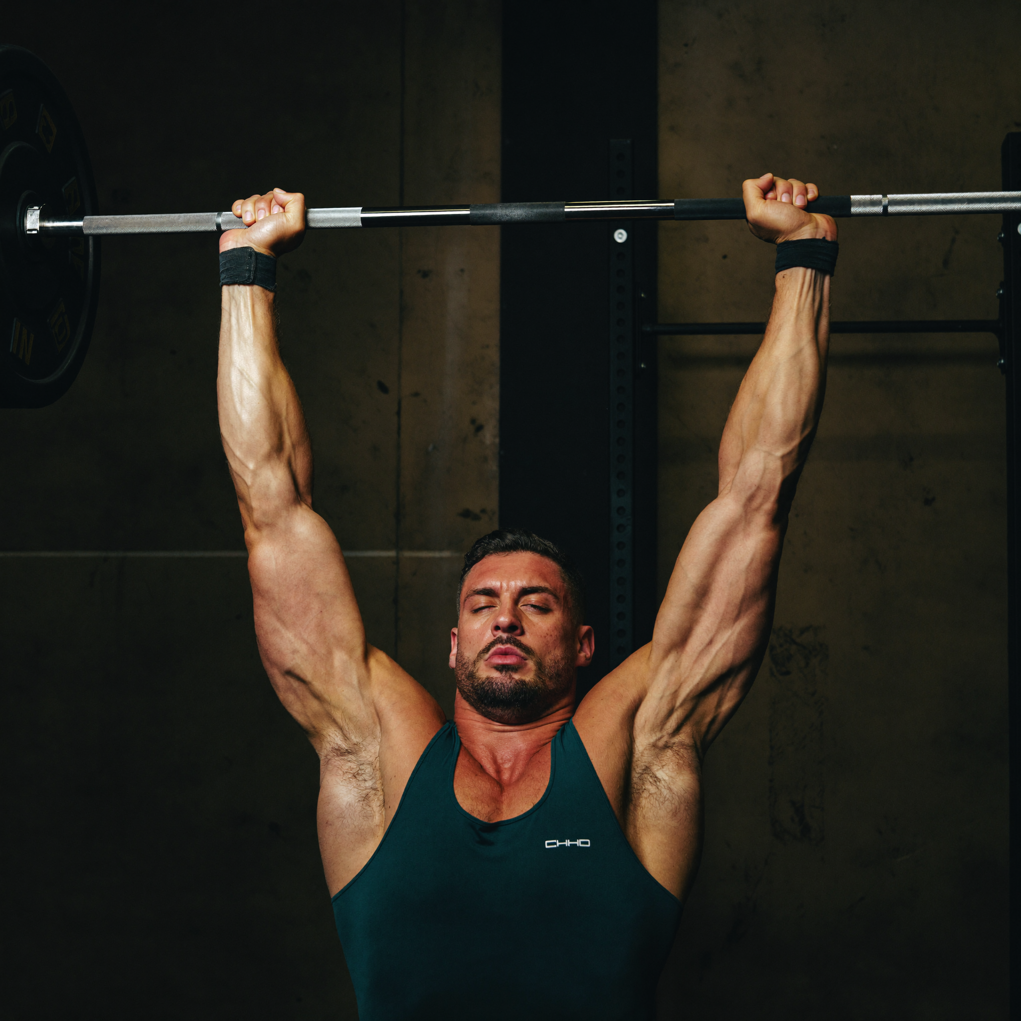 Man completing a heavy lift with visible effort and control