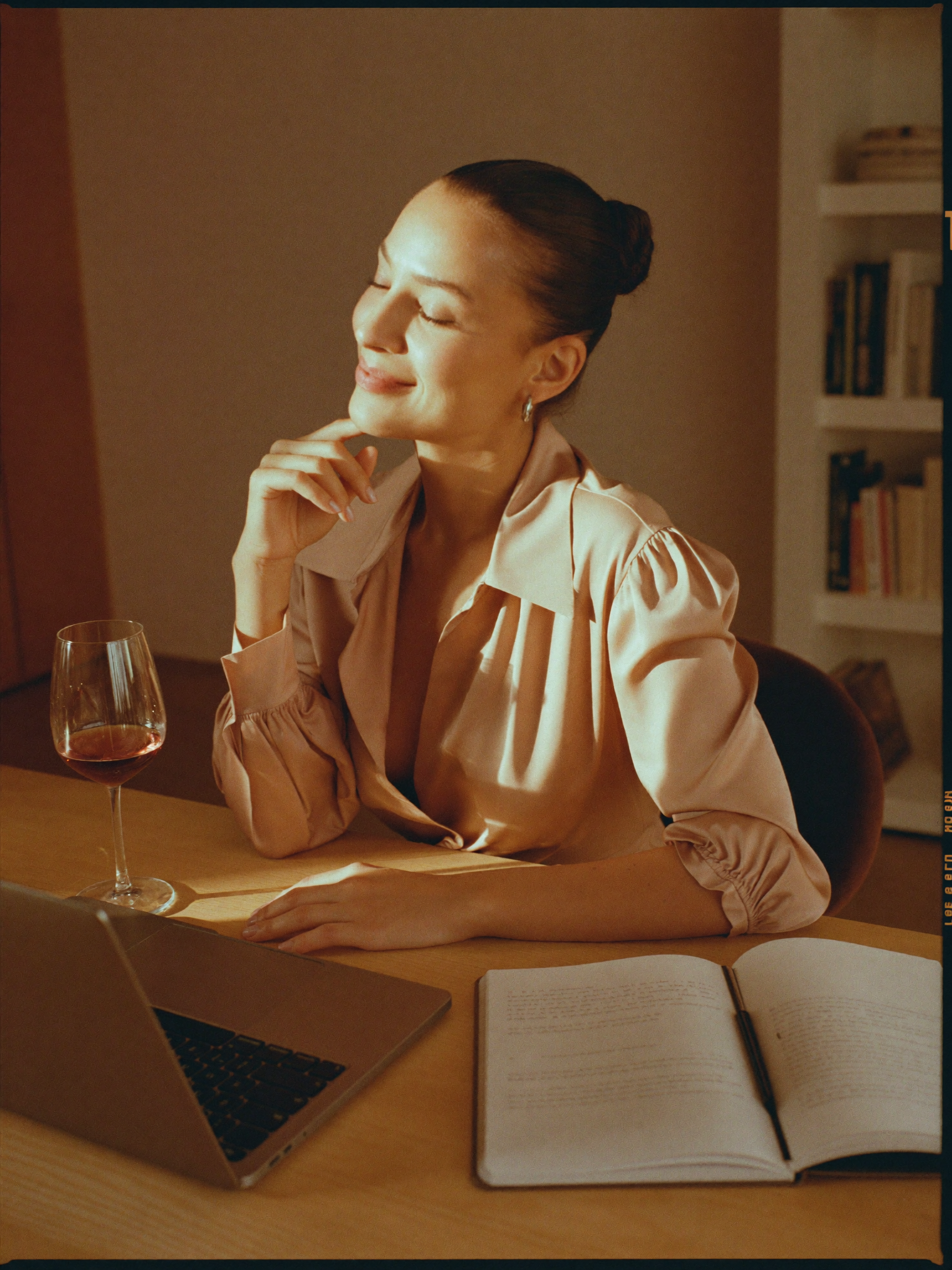 Professional learning wine at her own pace with a laptop and a glass of wine