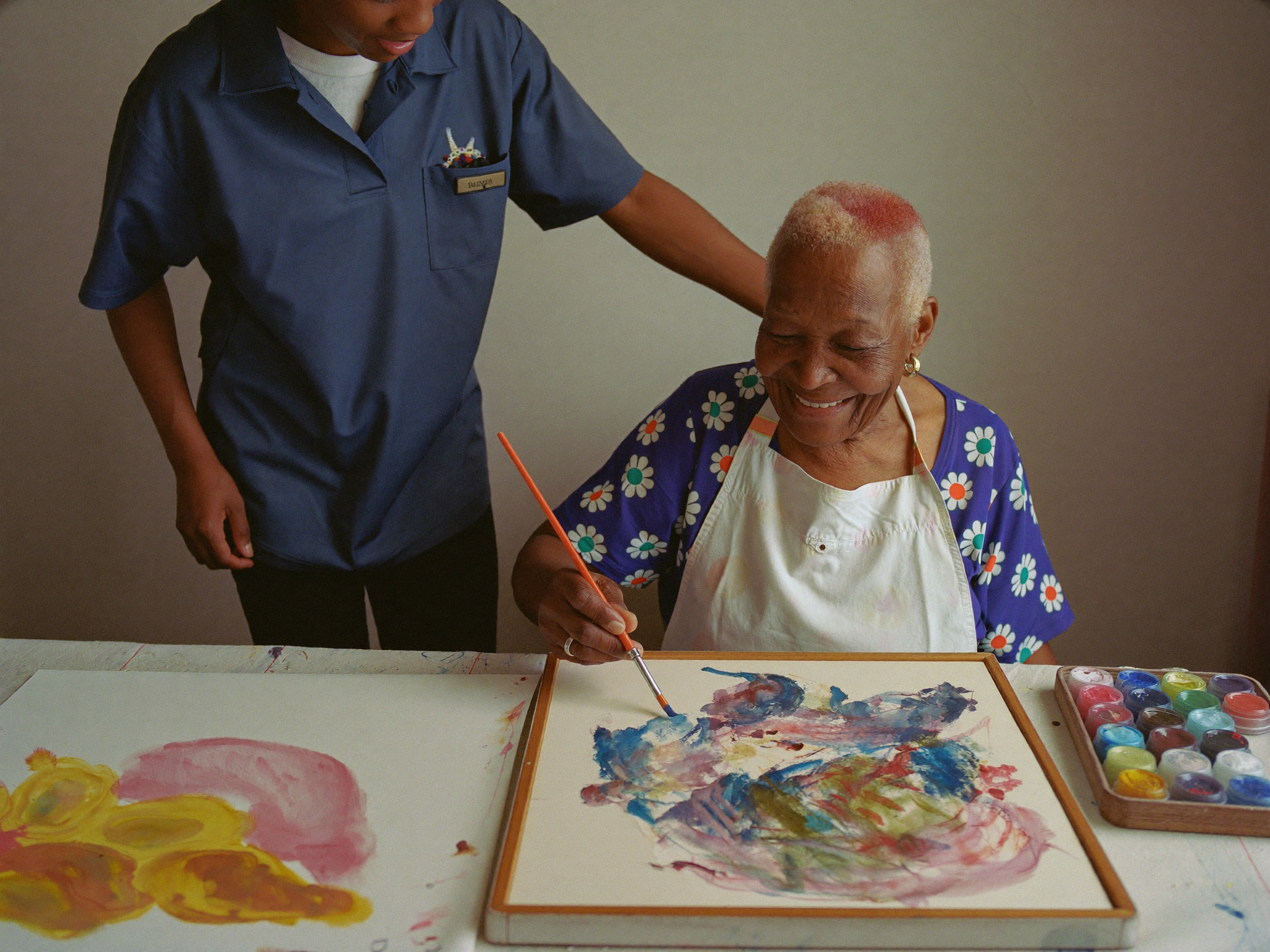 Senior enjoying the Albain Art Class with an art therapist (AI placeholder image)