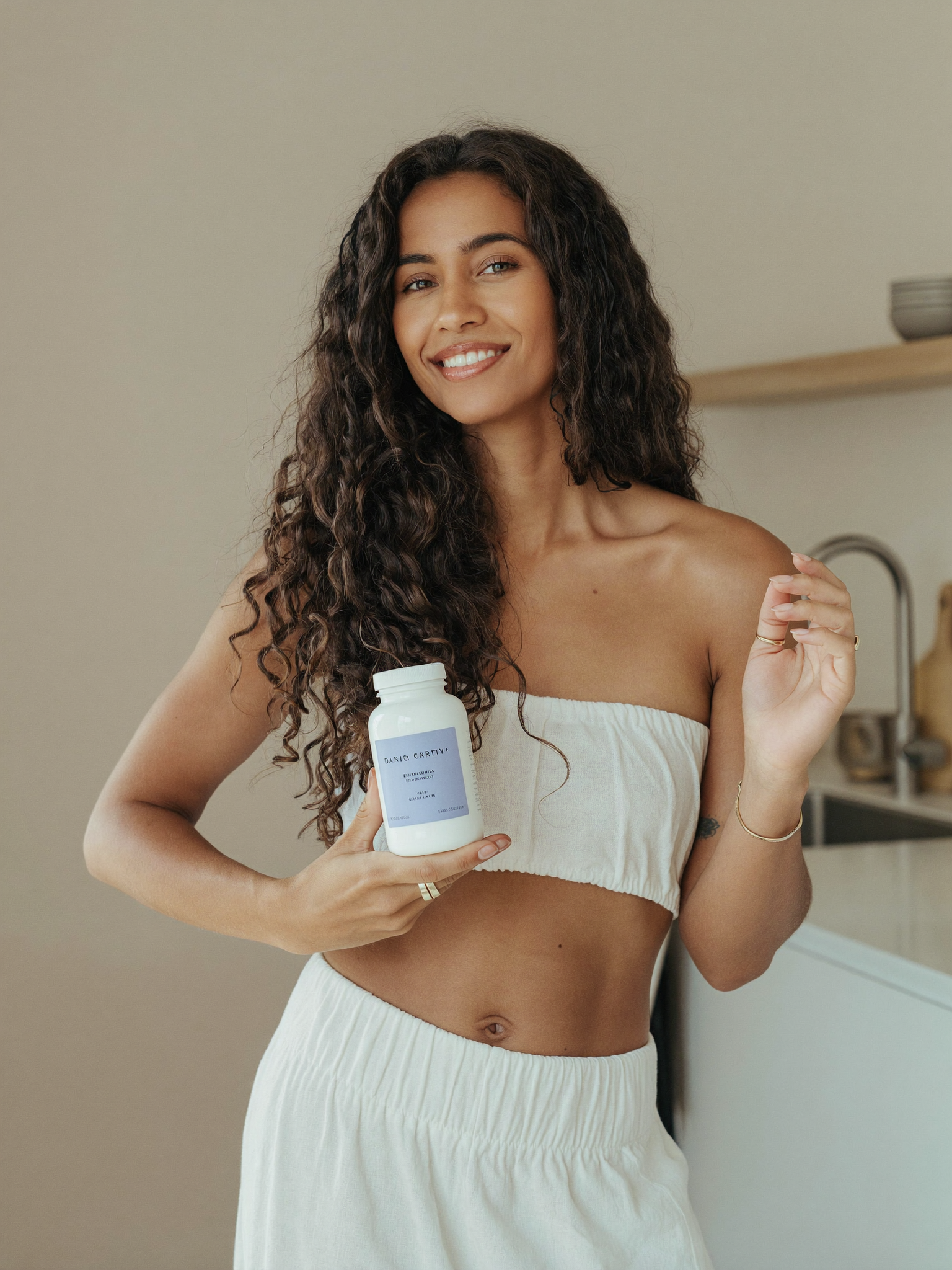 A parent holding Dawnly Clarity+ in her kitchen before the workday.