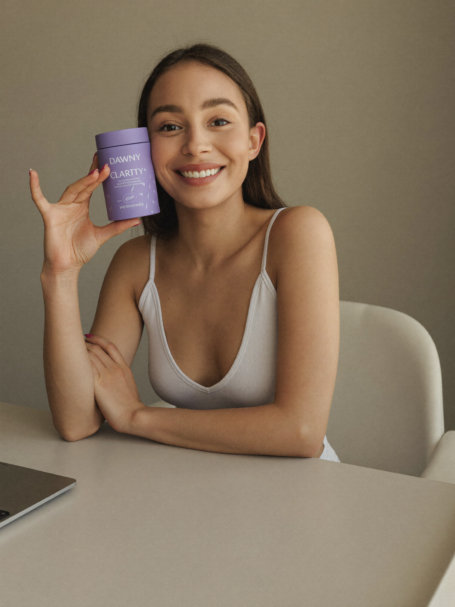 A founder holding Dawnly Clarity+ at her desk between meetings.