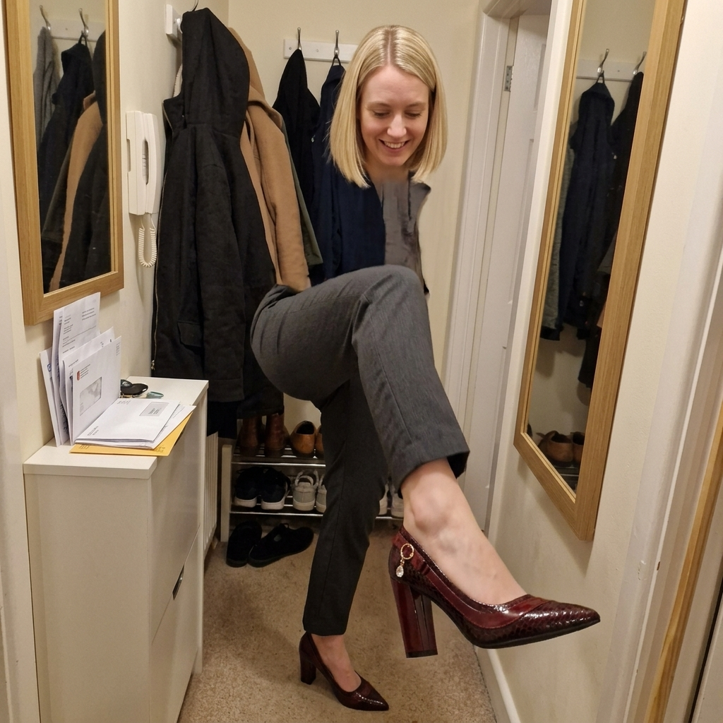 Customer wearing the Alessia Heels in a casual hallway