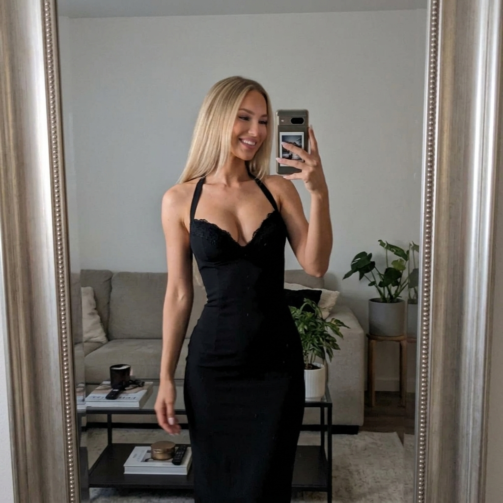 Customer wearing the Camille Halter Dress in a casual living room mirror selfie