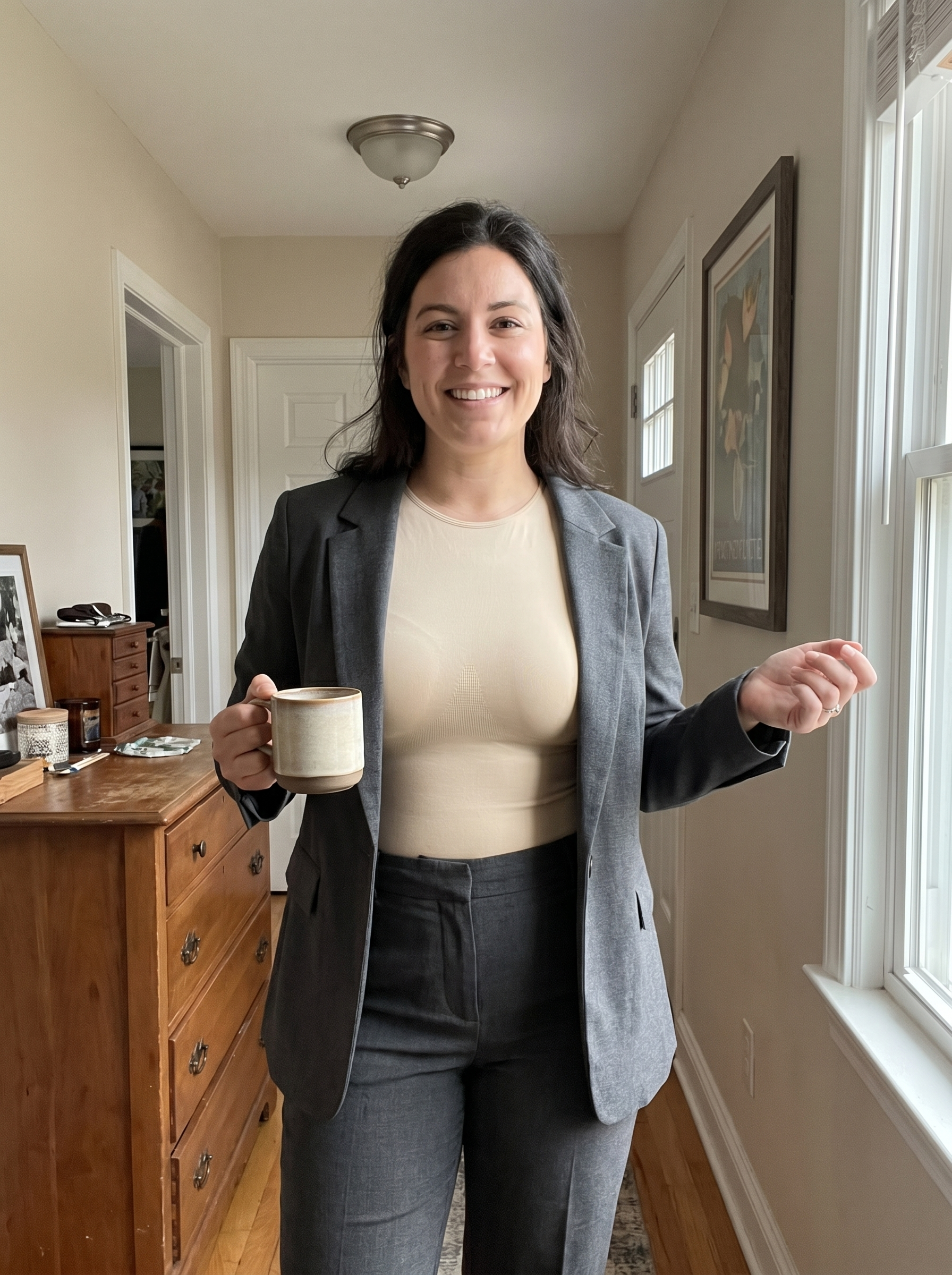 The Luksav High-Neck Bodysuit worn under a blazer for work