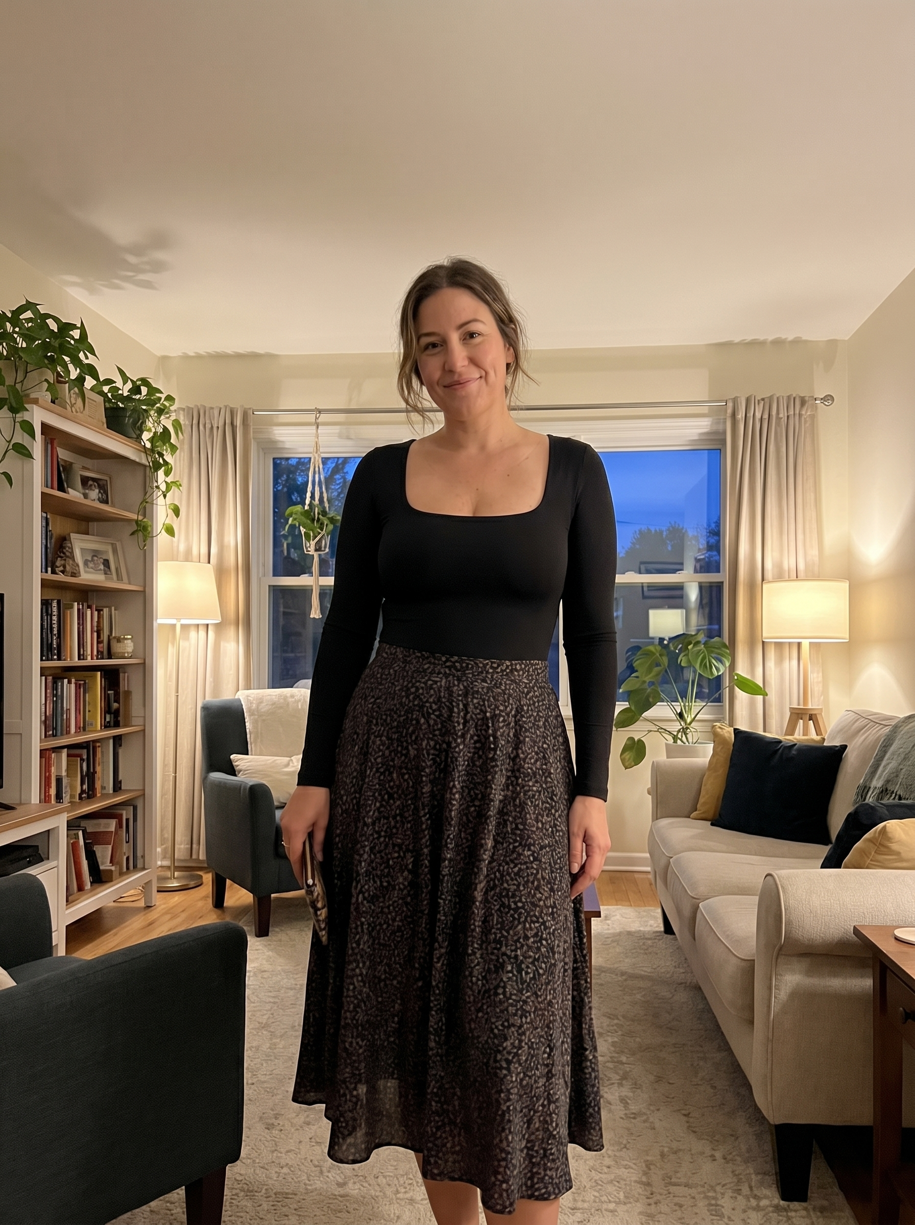 The Lift & Smooth Bodysuit worn as a top with a midi skirt