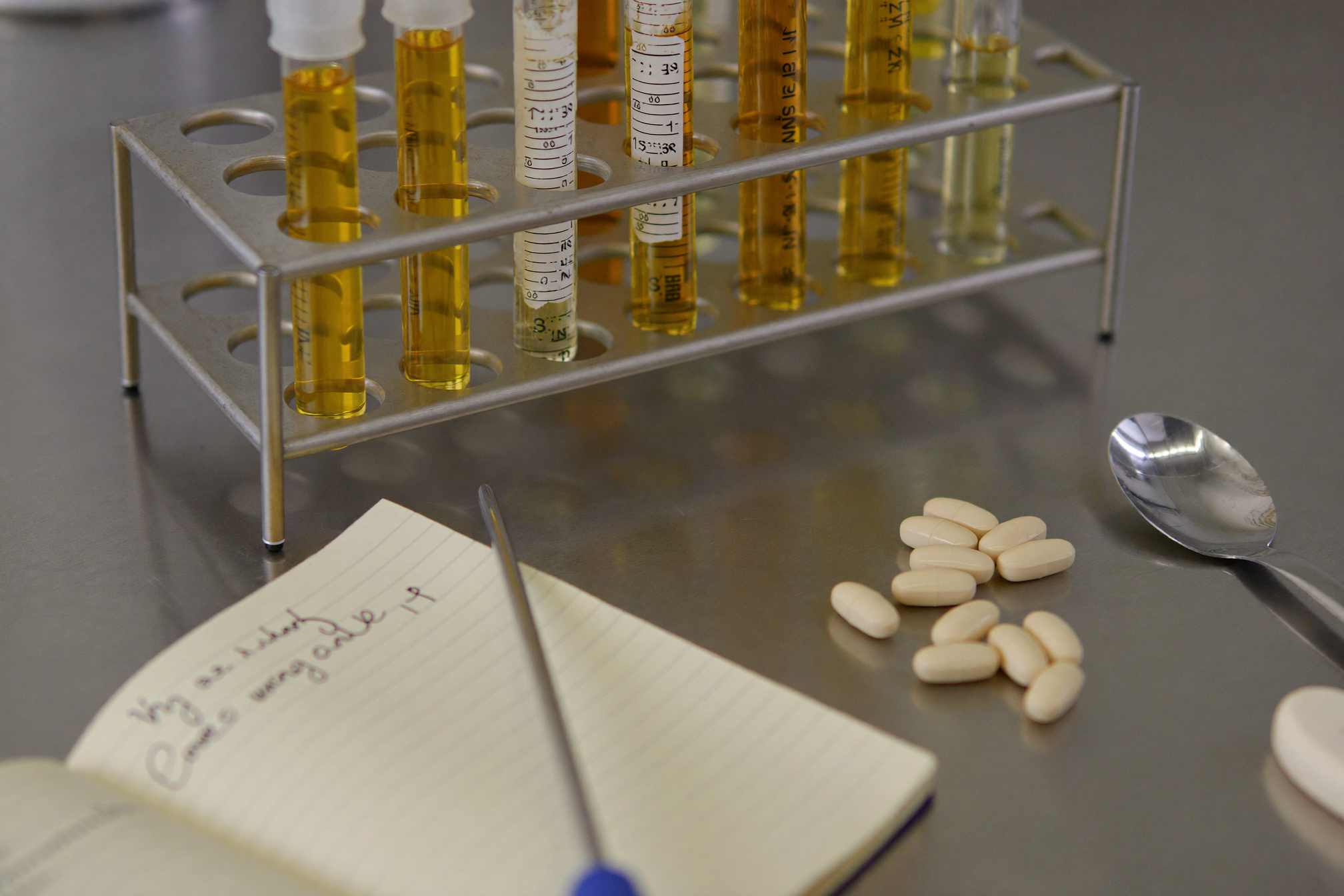 Lab bench with test tubes and notebook