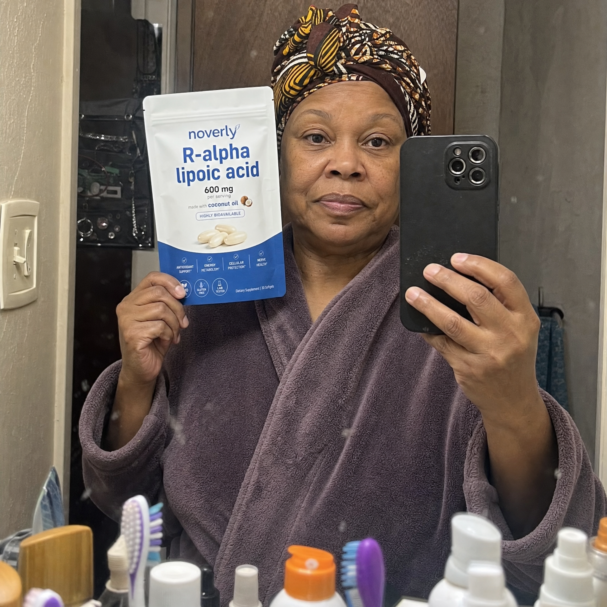 Yvonne Hatcher holding Noverly R-Alpha Lipoic Acid