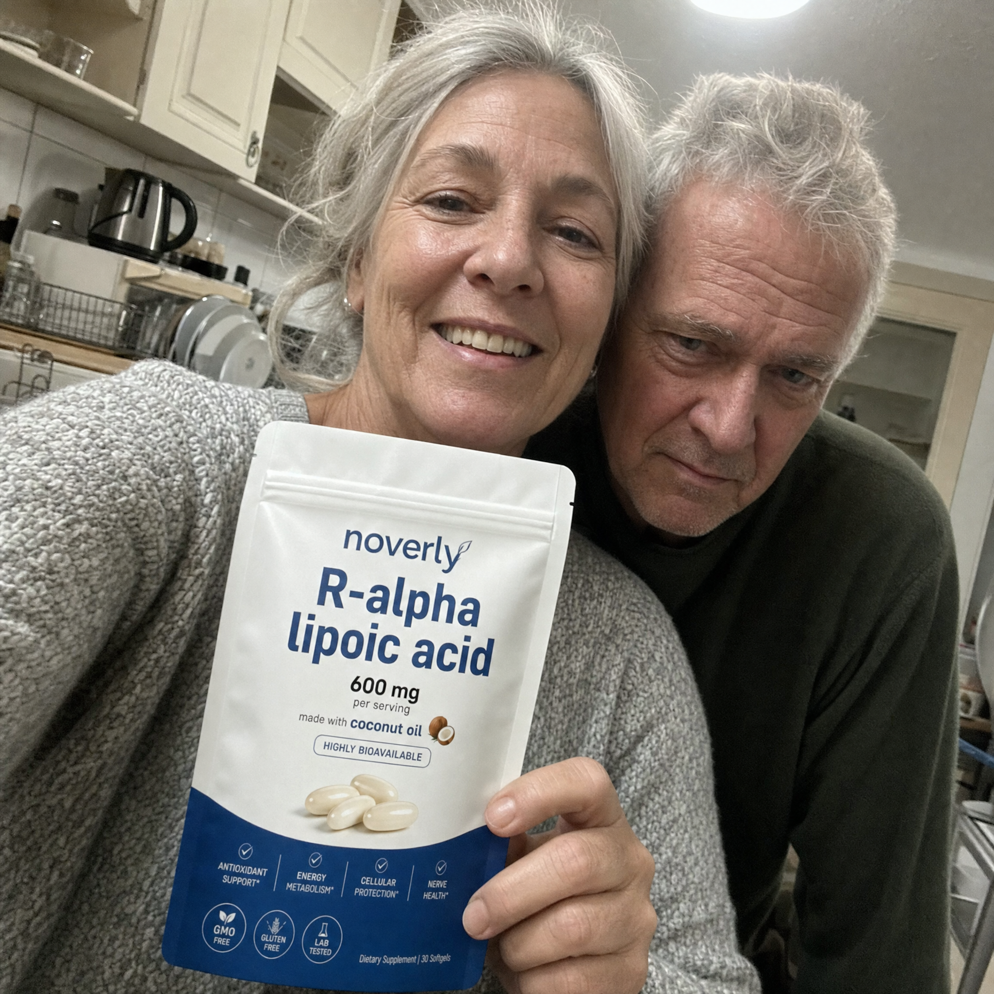 Wanda and Earl Prejean holding Noverly R-Alpha Lipoic Acid