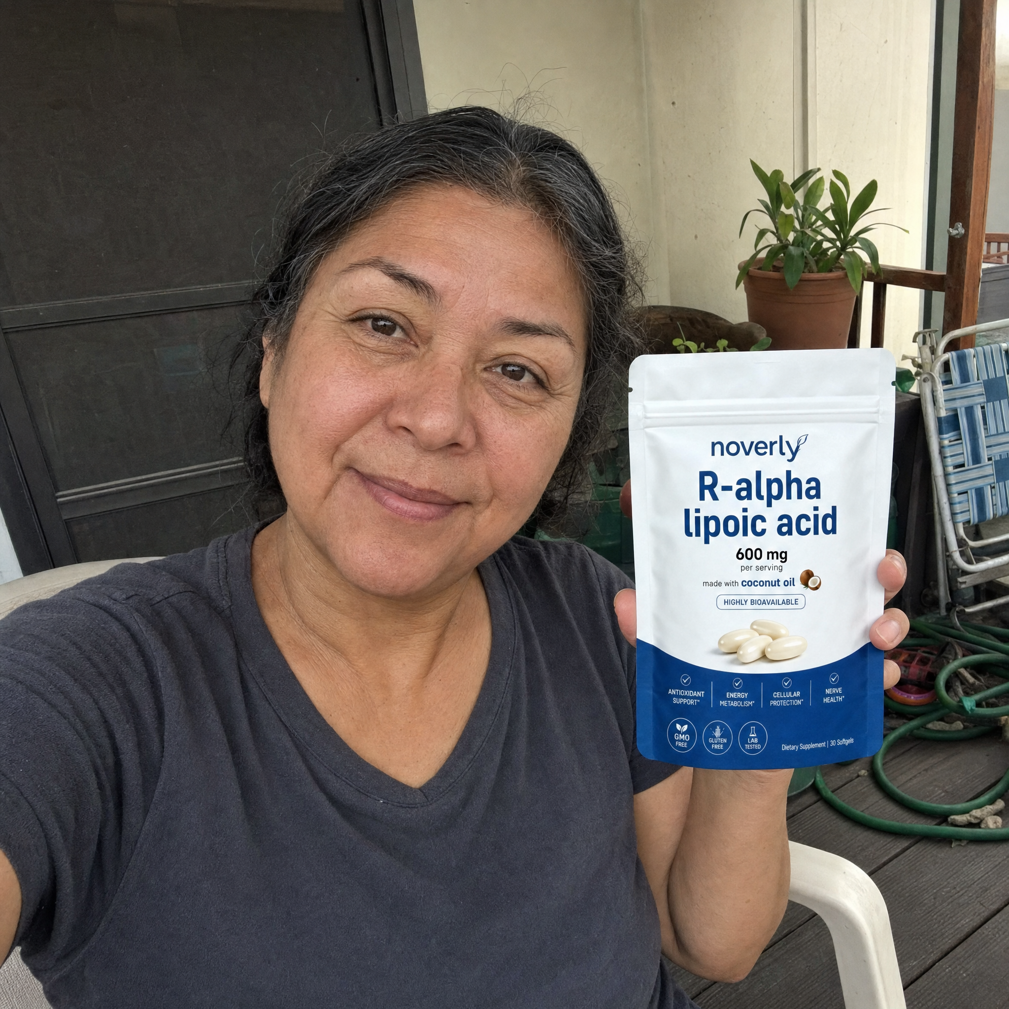 Customer on her back porch holding the Noverly pouch