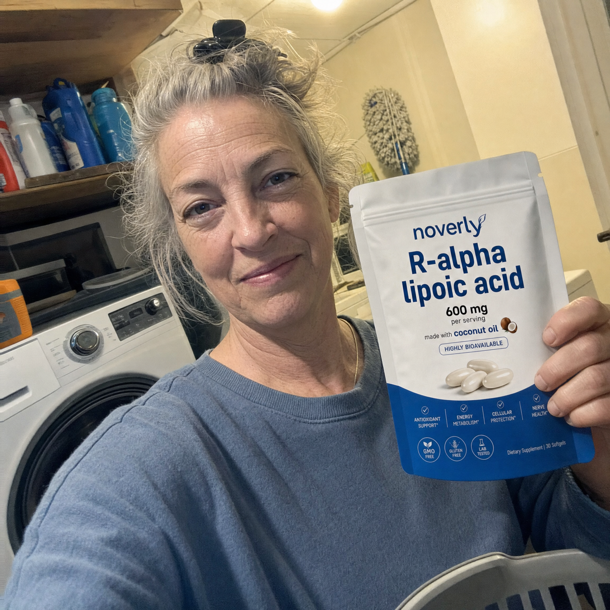 Customer in her utility room holding the Noverly pouch