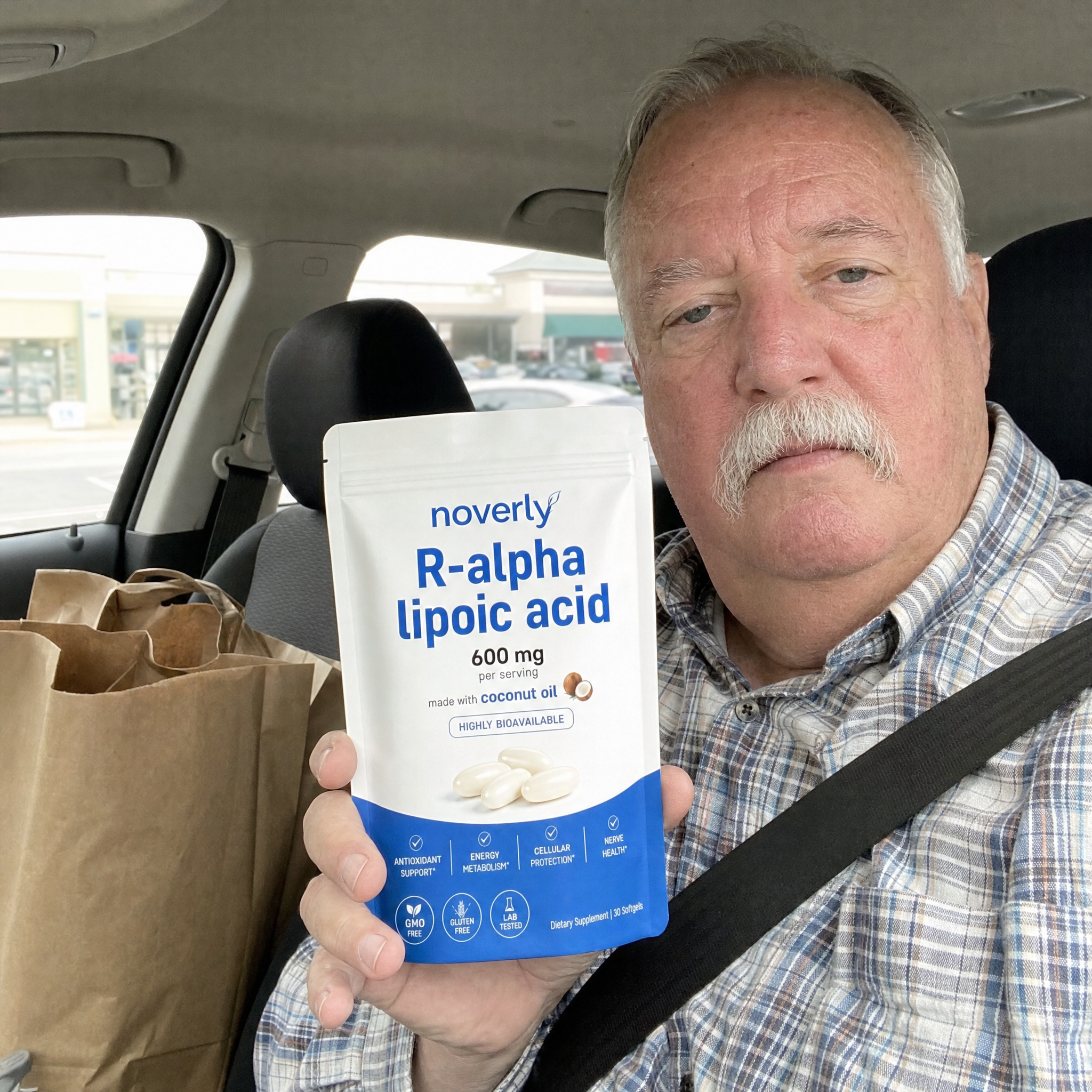 Dale K. holding Noverly R-Alpha Lipoic Acid