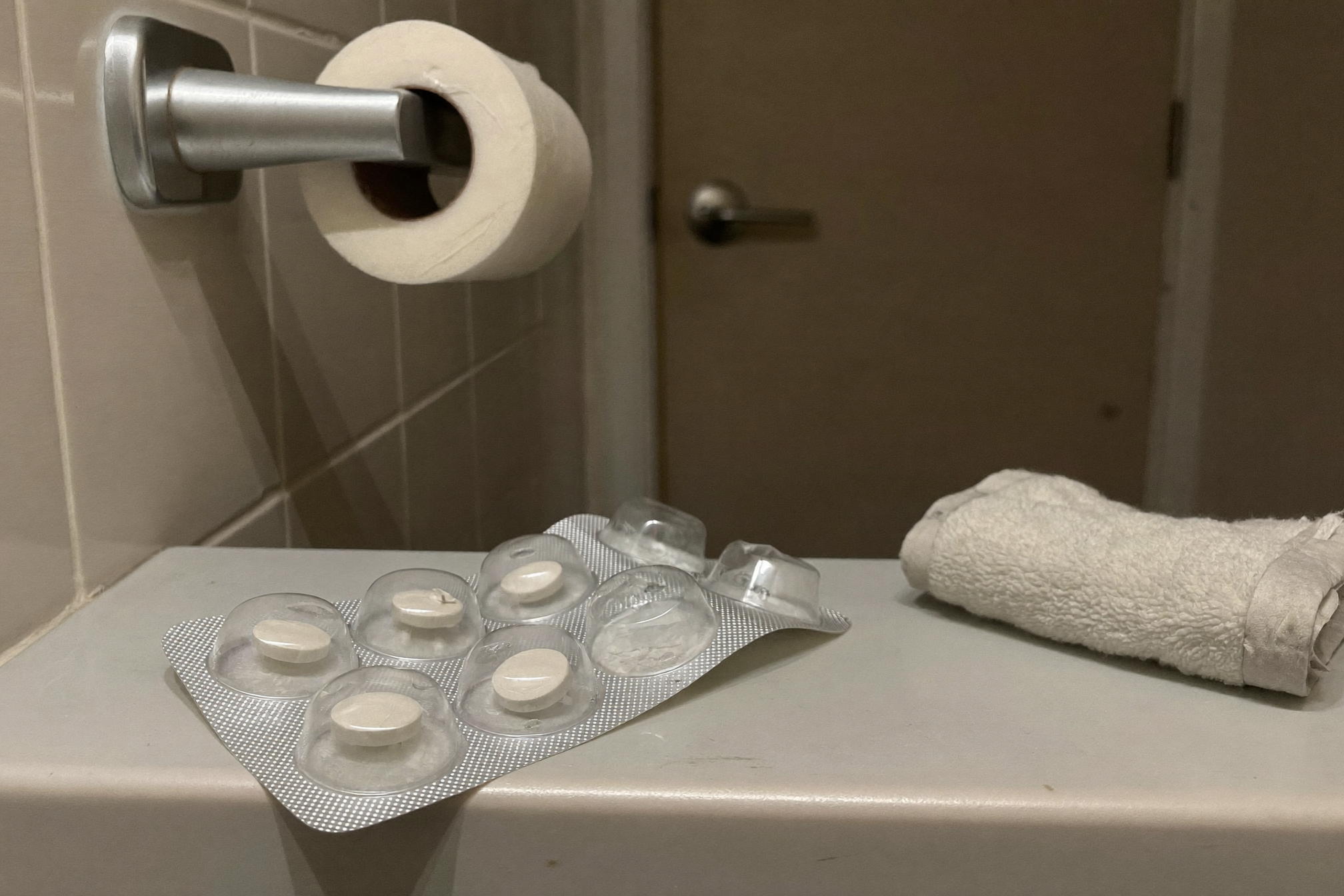 A half-used blister pack on a bathroom shelf