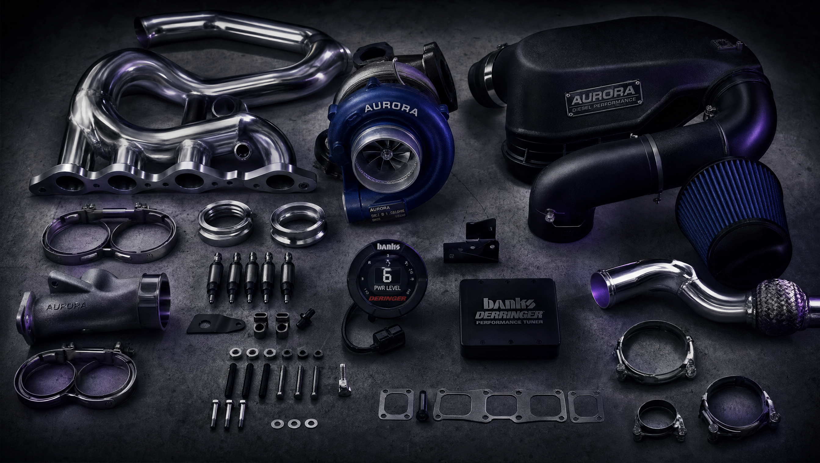 Collection of diesel performance parts on dark surface