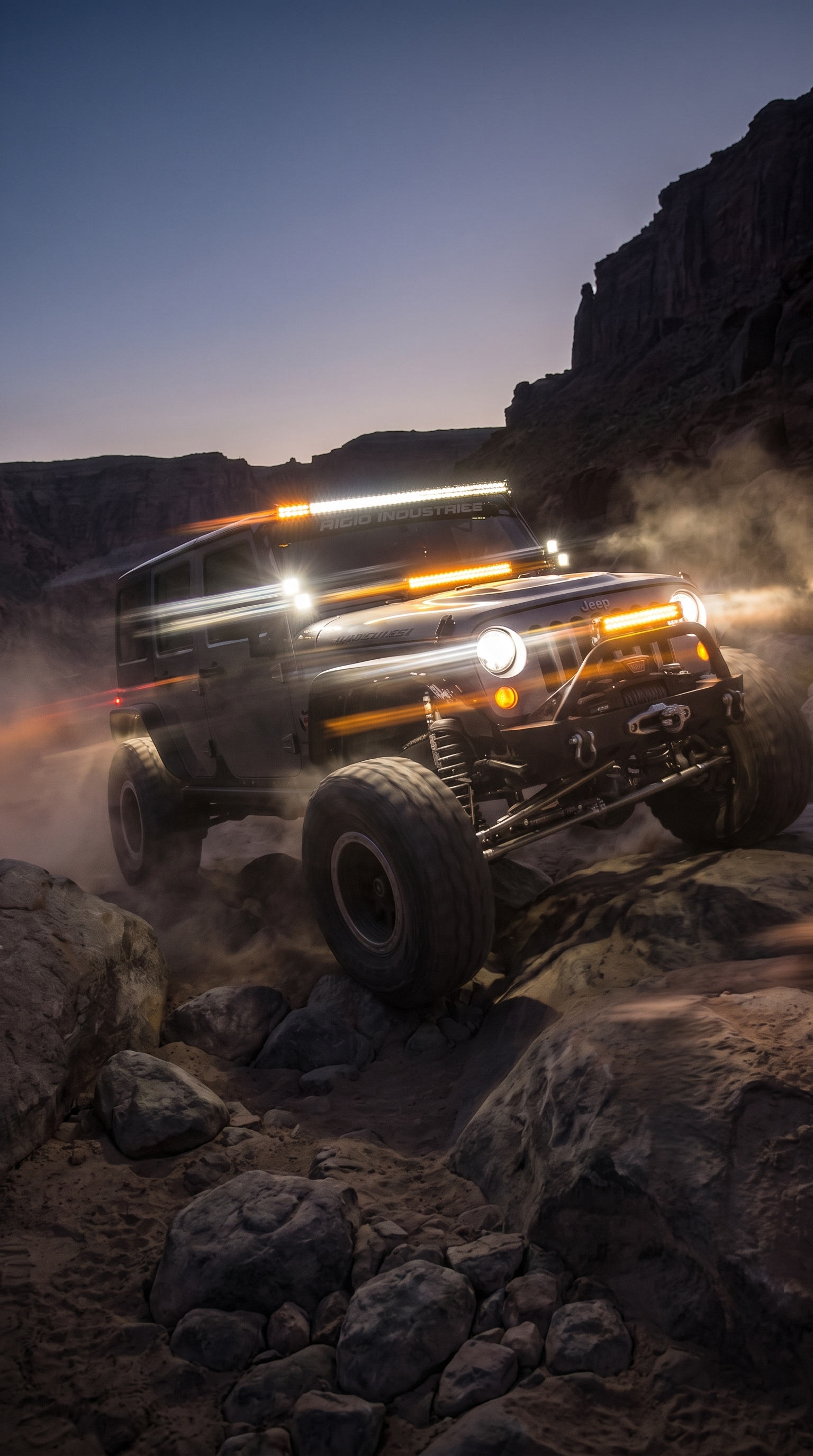 Jeep rock crawling at night with LED light bars and amber accent lighting