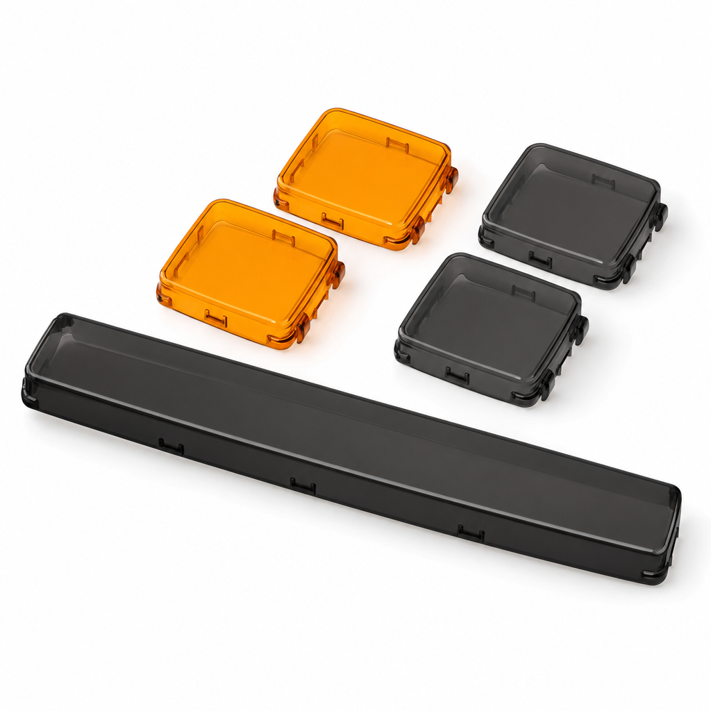 Amber and smoked snap-on light covers on white background