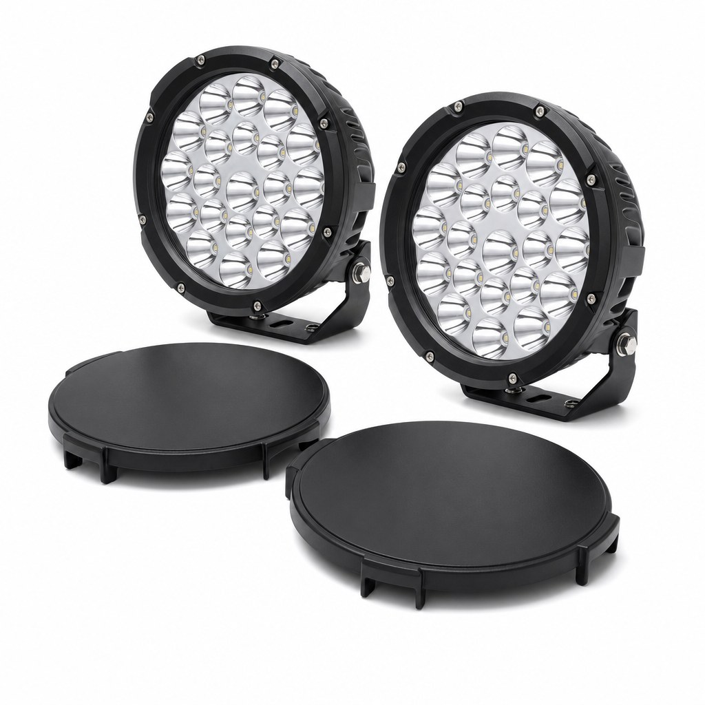 Round off-road driving lights with covers on white background