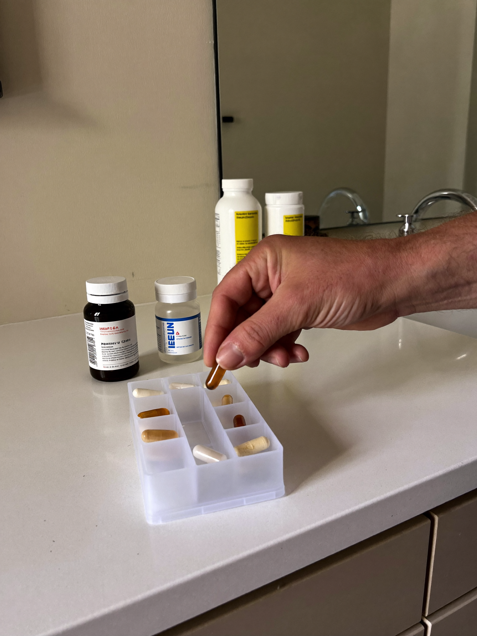 Softgel next to pill organizer