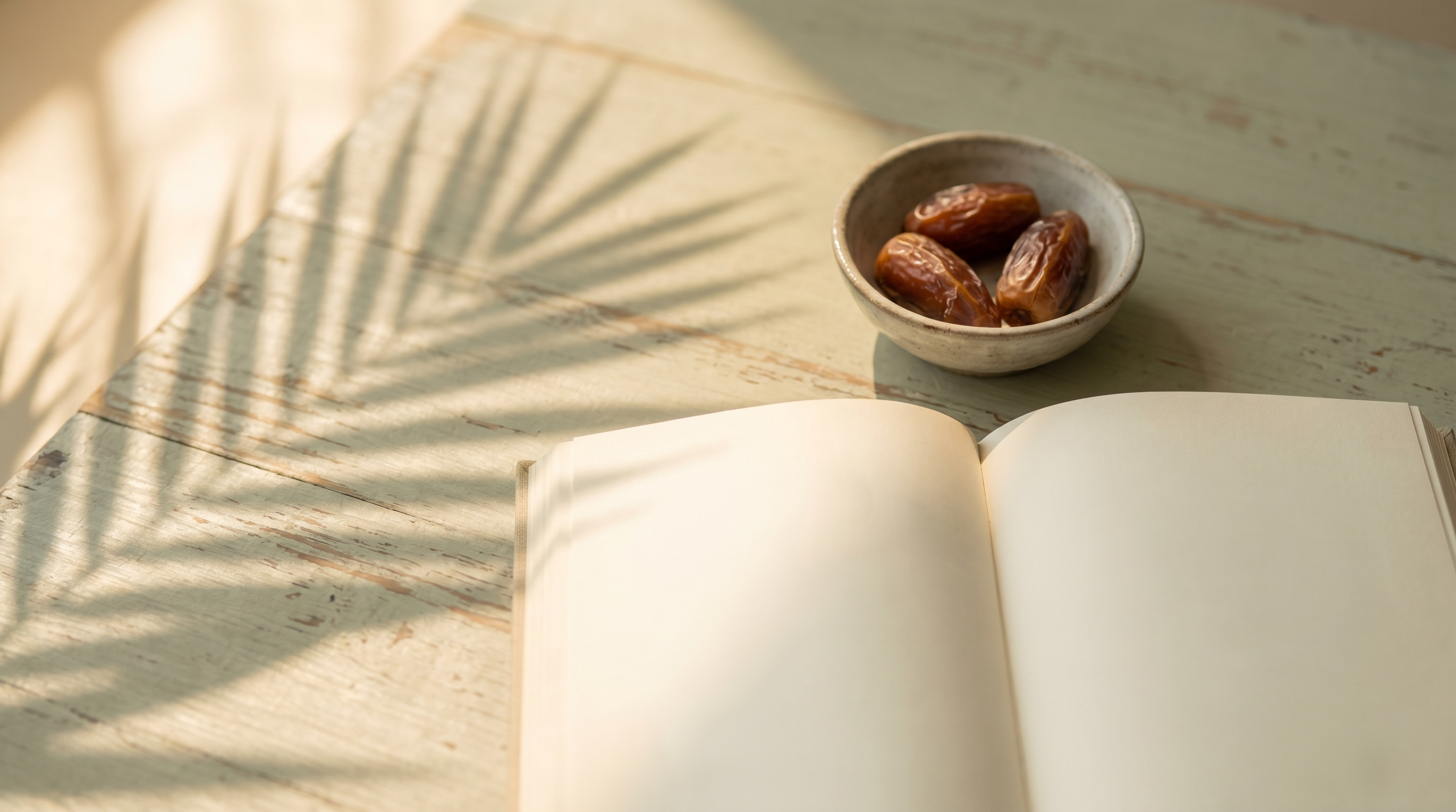An open Qur'an on a wooden table beside a small cup of dates in soft morning light, evoking a quiet Shawwal morning.