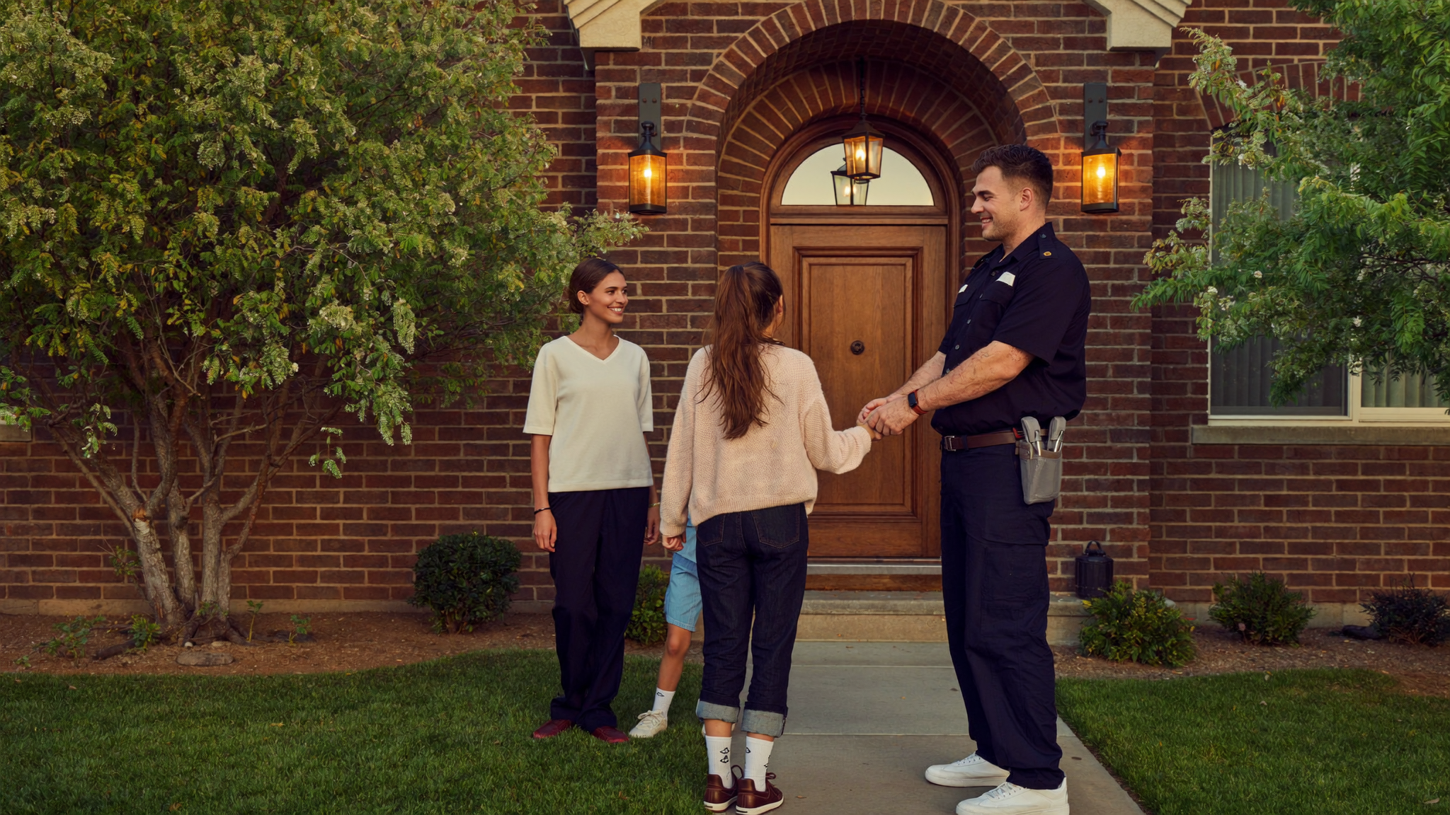 Technician greeting a family at a Charlotte home