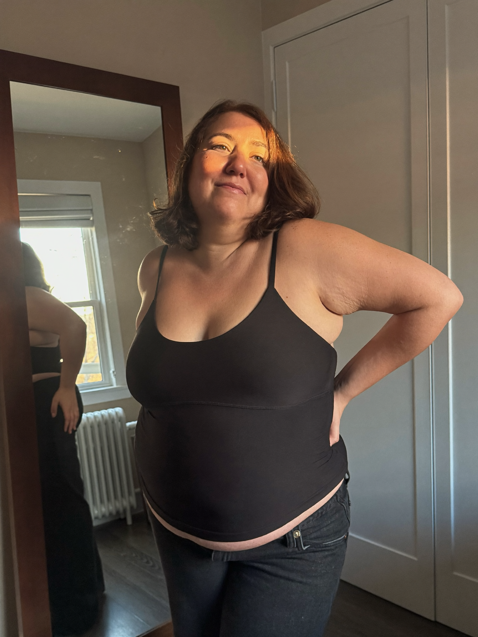 Wearing the Shapova tank in front of the mirror