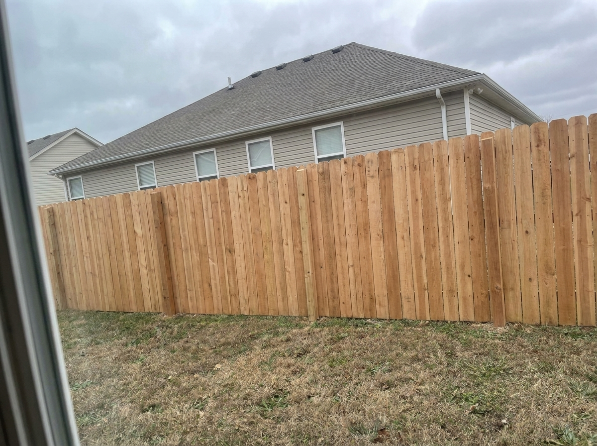 New 6-foot cedar privacy fence in the same backyard