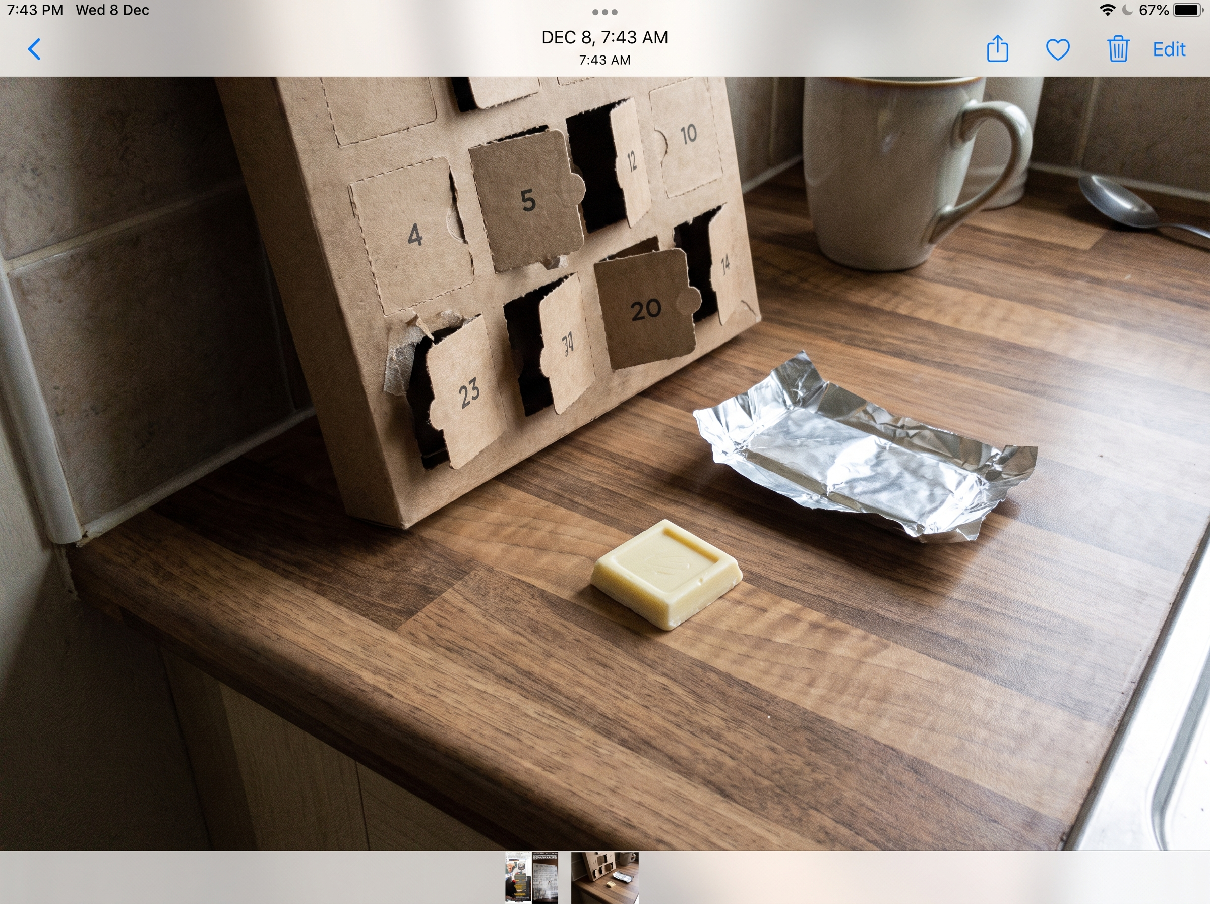The torn-open chocolate calendar and the waxy piece inside
