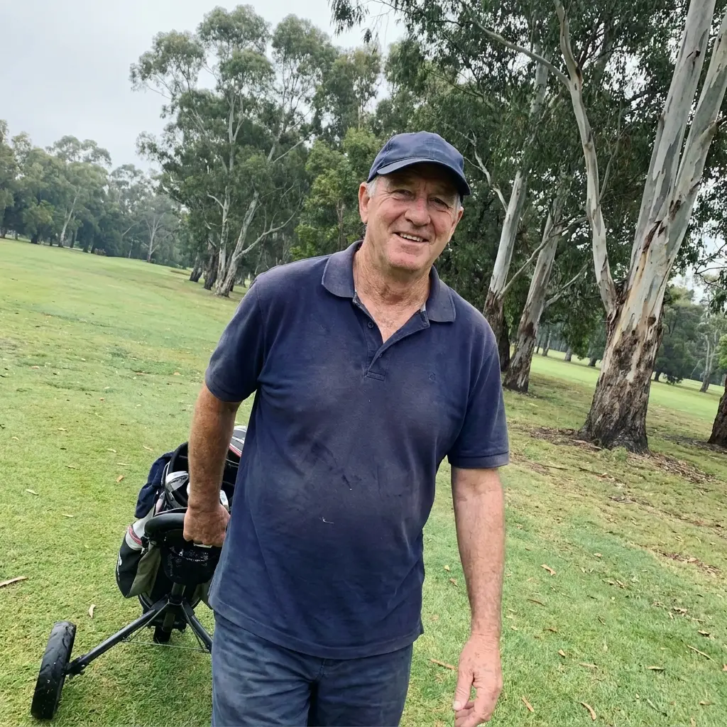 Greg on the fairway with his push buggy