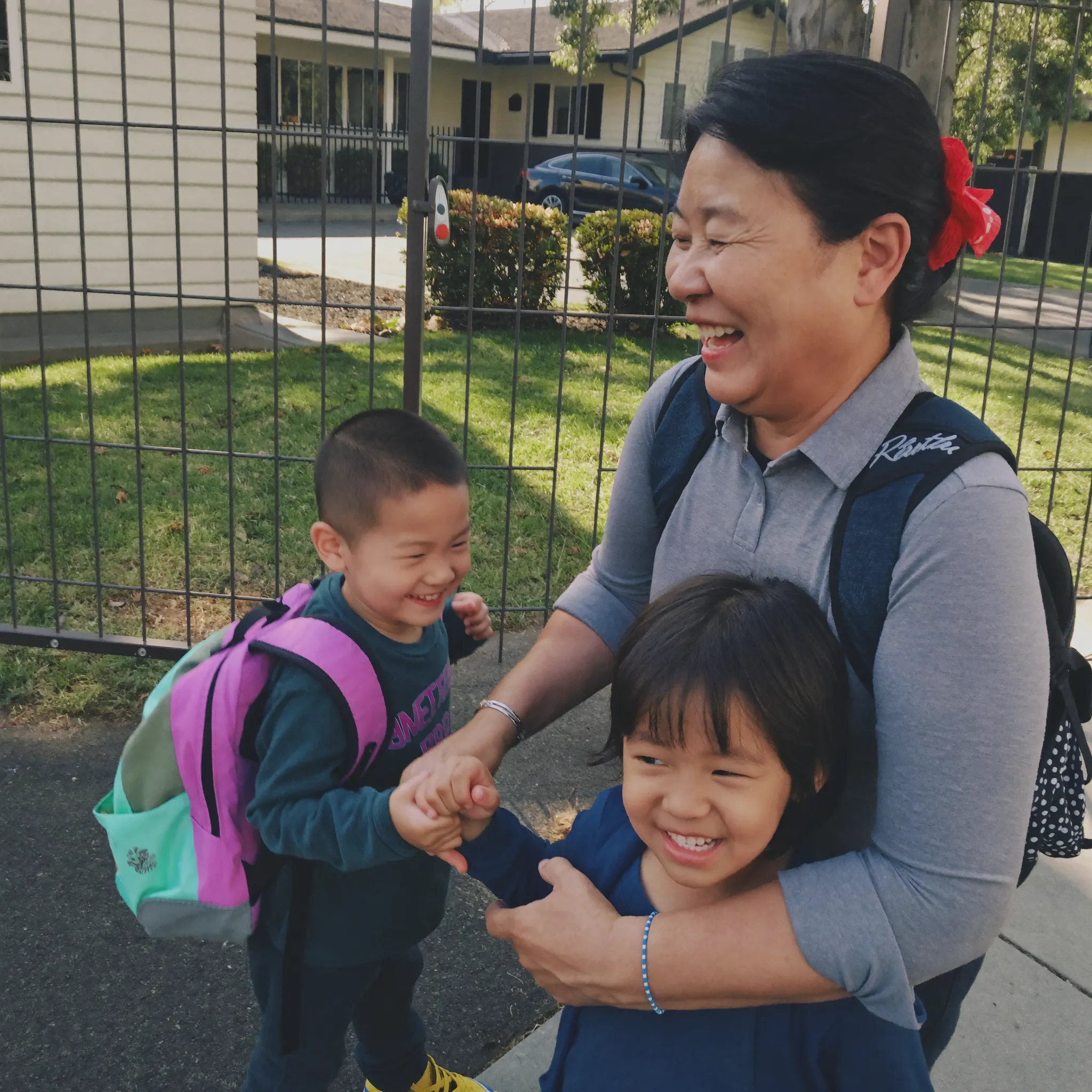 Mei picking up her grandkids from school