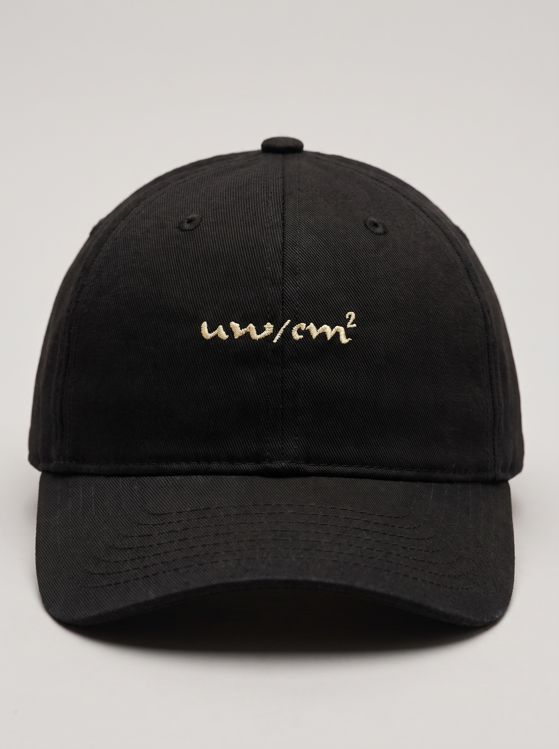 Close-up of the µW/cm² embroidery on the Halo Cap