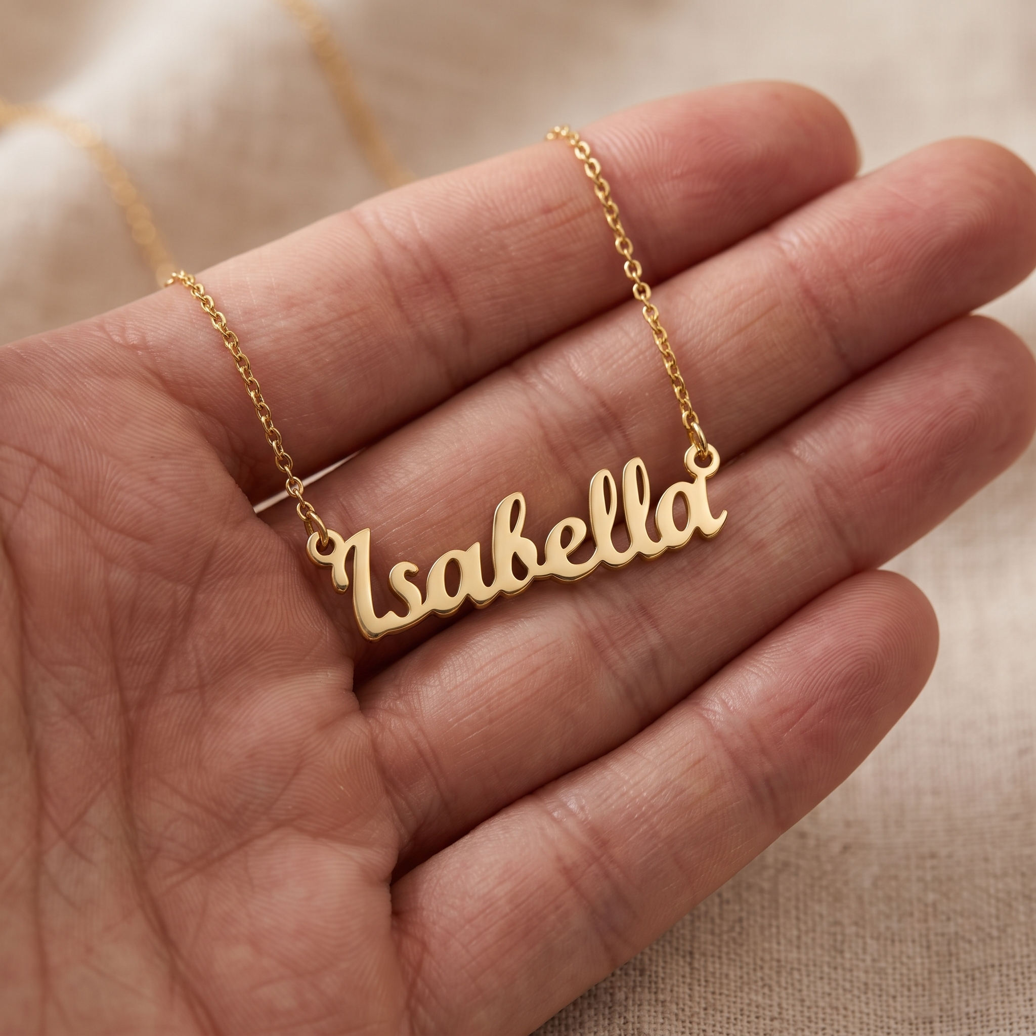 Layered necklaces and a stacked hand shown together in everyday light