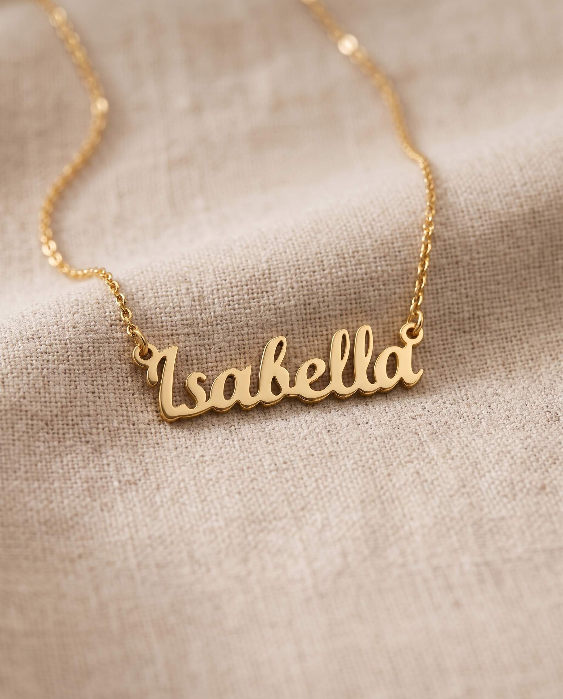 Layered necklaces at different lengths over a plain neutral top