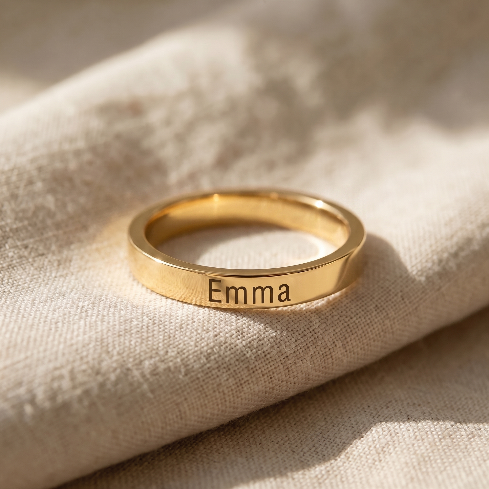 A stack of plain bands with a single coloured stone among them
