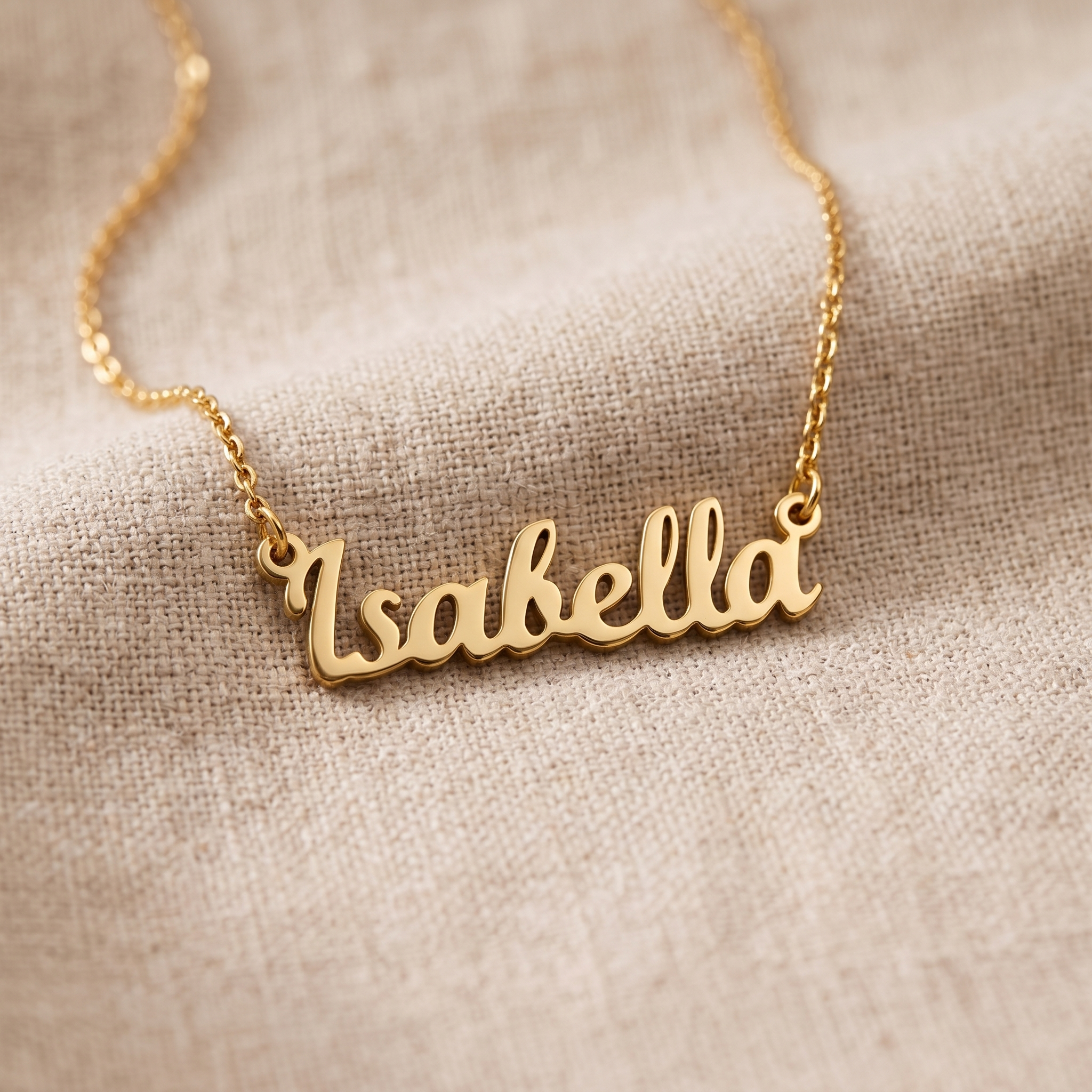 A bright, unmarked pendant resting on pale linen in daylight