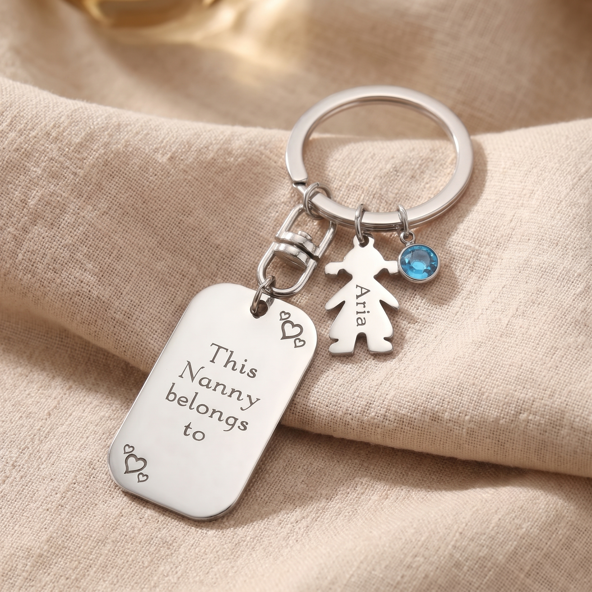 A father accepting a set of keys with a personalised charm keyring from his child