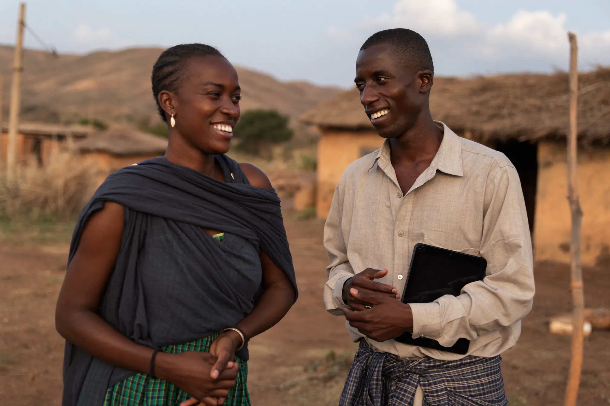 A field enumerator collecting survey data on a tablet in rural Ethiopia