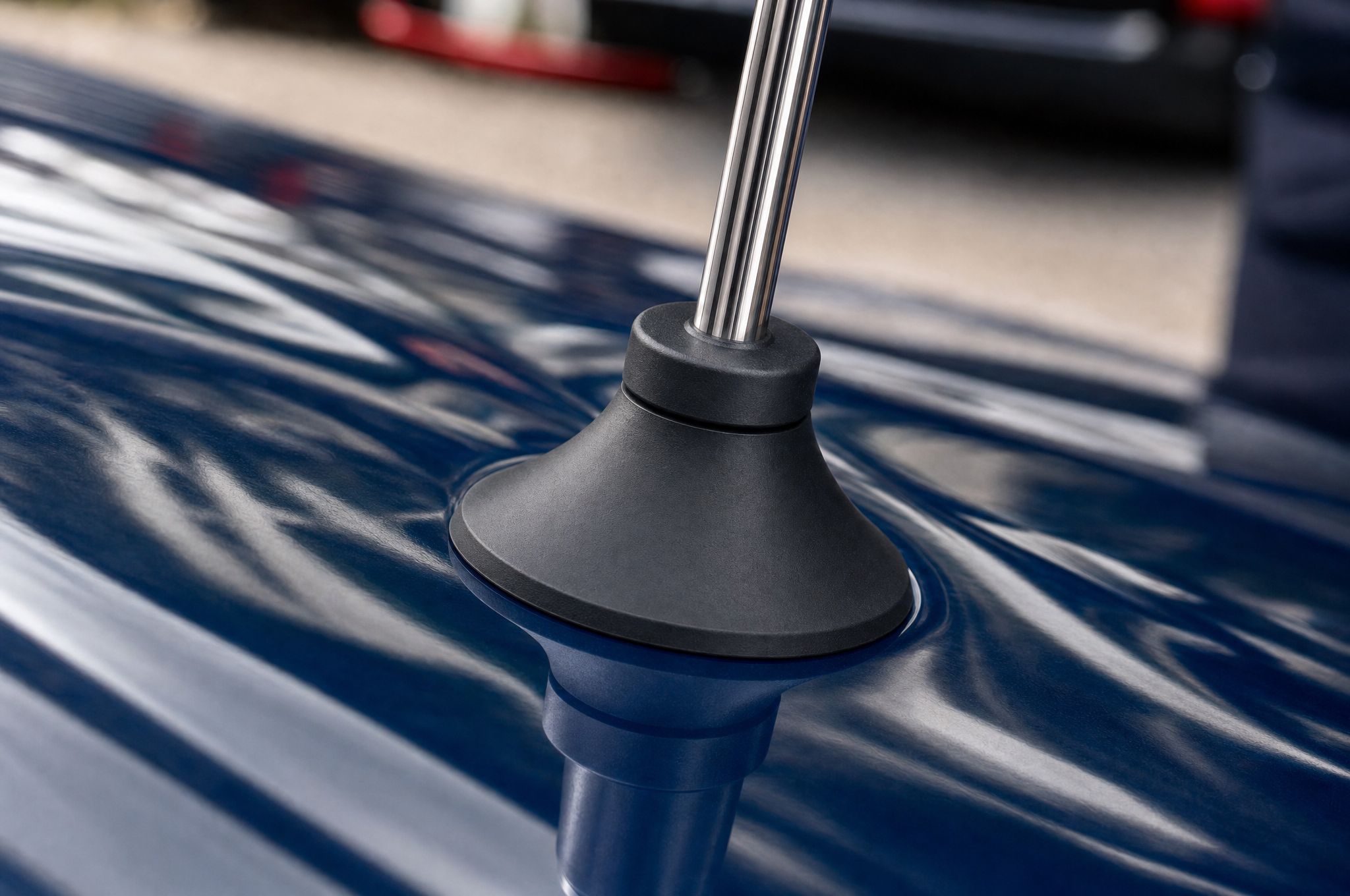 The vacuum-sealed rubber cup gripping glossy paint
