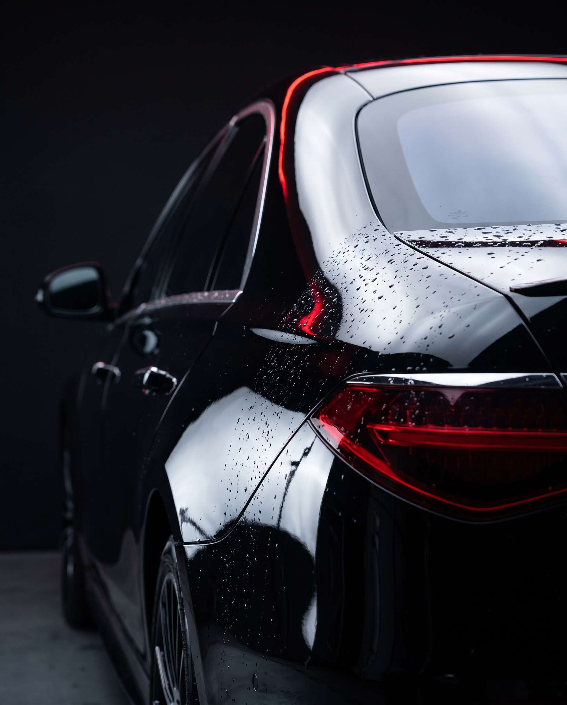 Black luxury car with deep ceramic gloss