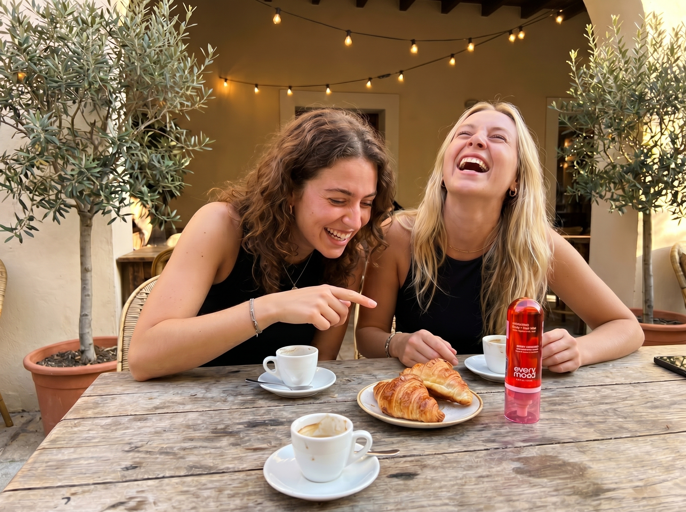 Woman at brunch with Berry Obsessed mist on the table